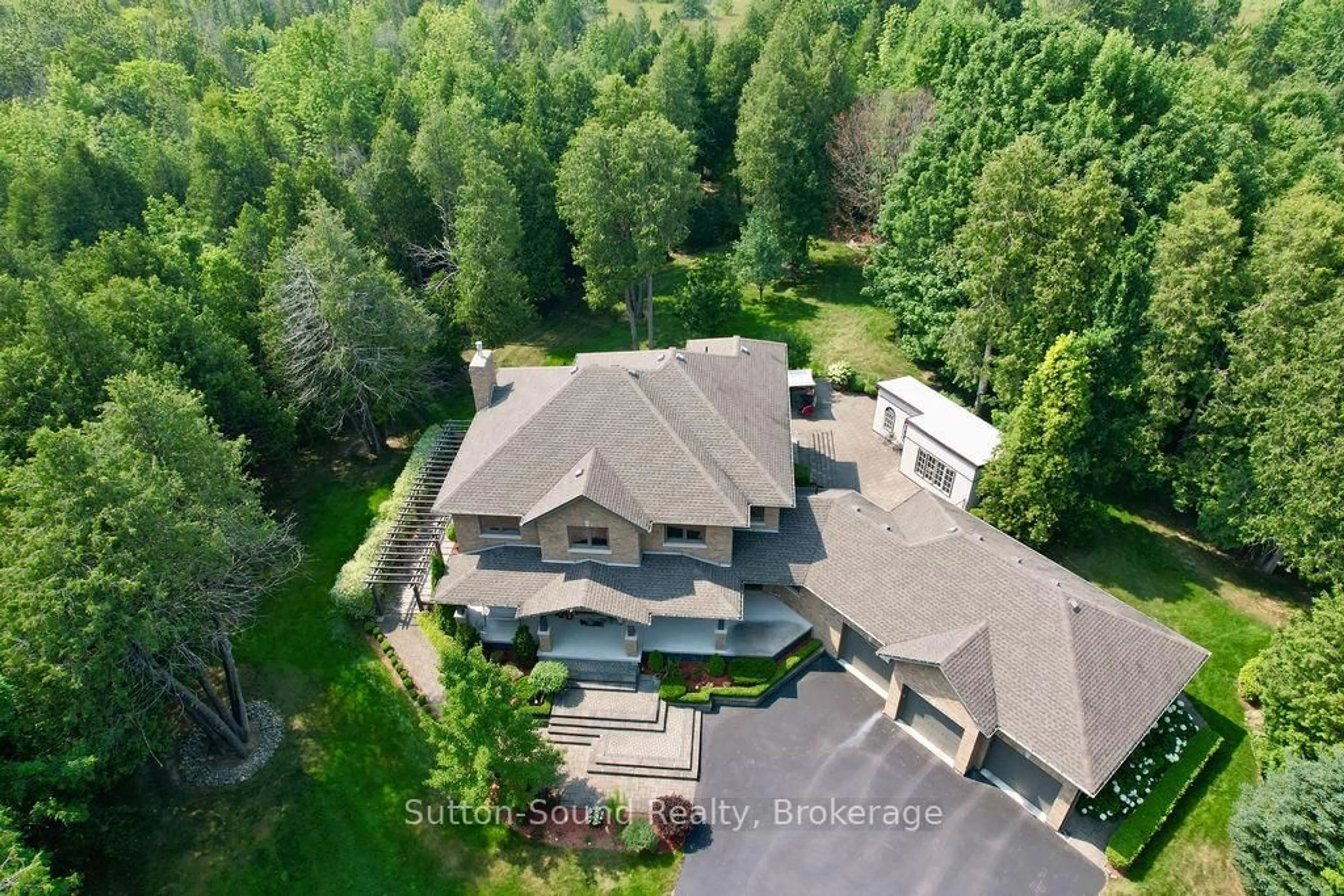 A pic from outside/outdoor area/front of a property/back of a property/a pic from drone, unknown for 318760 Grey Road 1 Rd, Georgian Bluffs Ontario N4K 5N4