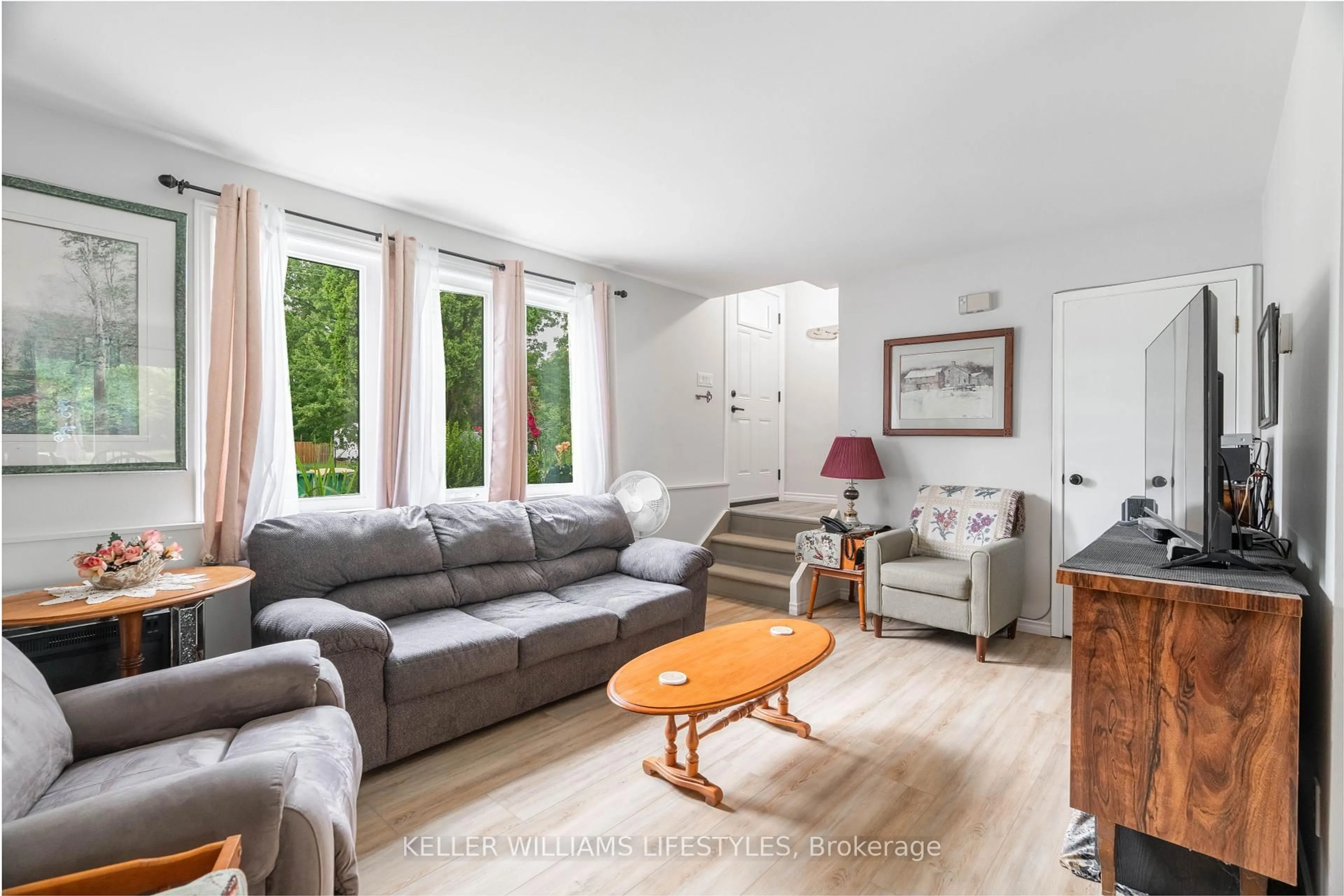 Living room with furniture, wood/laminate floor for 155 Water St #2, Southwest Middlesex Ontario N0L 1M0