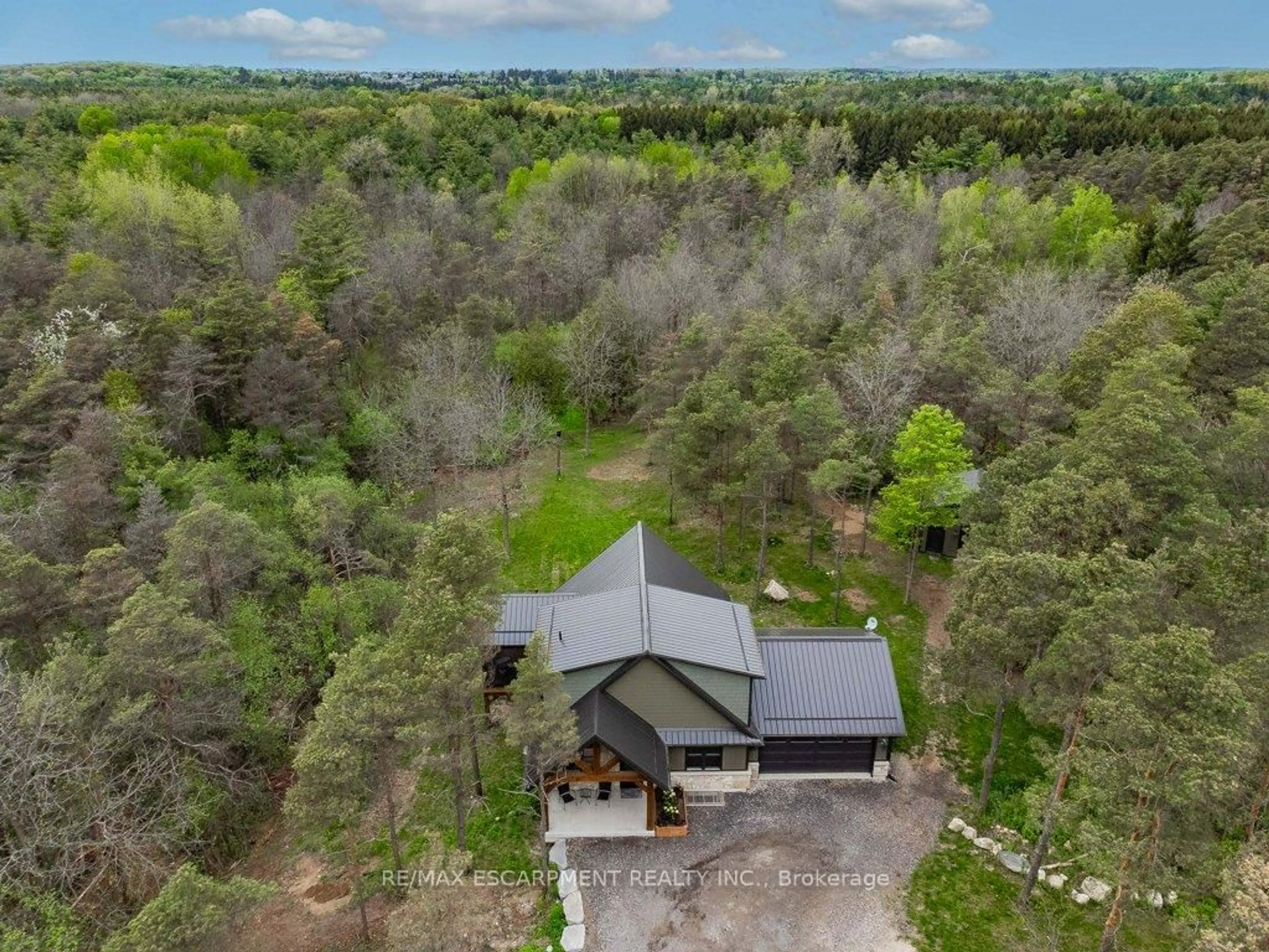 A pic from outside/outdoor area/front of a property/back of a property/a pic from drone, forest/trees view for 1040 Clyde Rd, North Dumfries Ontario N1R 5S7