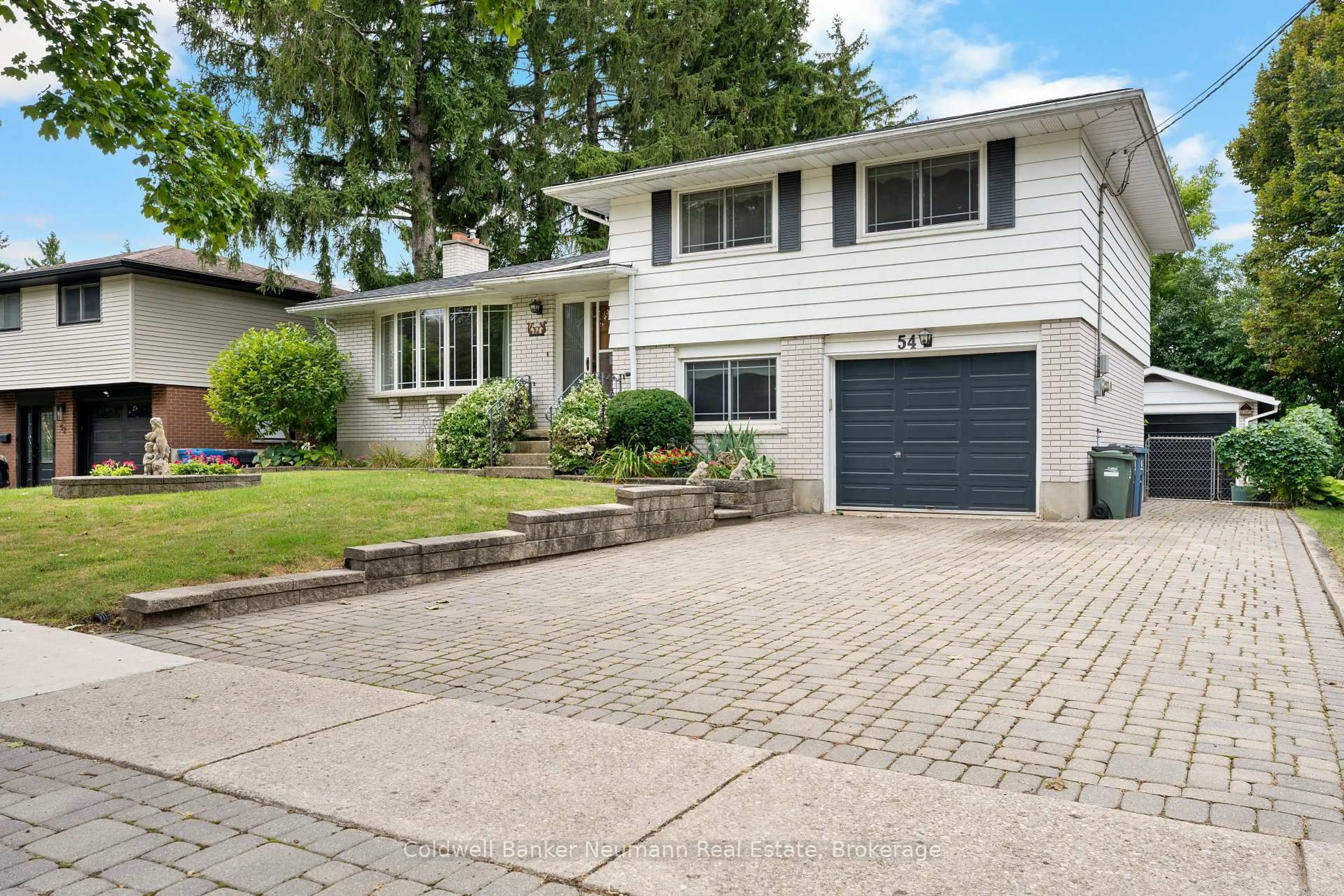 Home with vinyl exterior material, street for 54 Glenburnie Dr, Guelph Ontario N1E 4C6