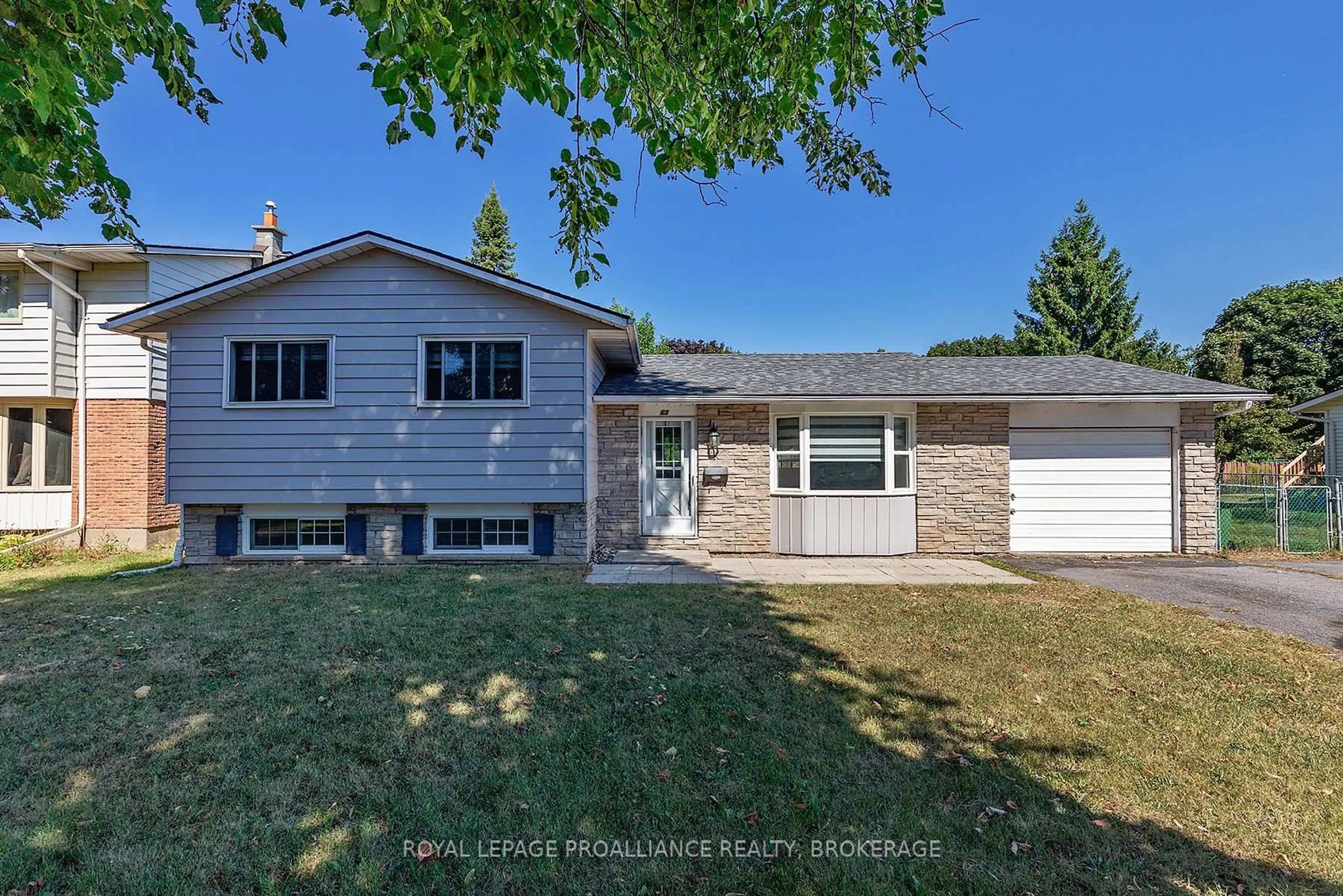 Home with vinyl exterior material, street for 63 Old Oak Rd, Kingston Ontario K7M 6X2