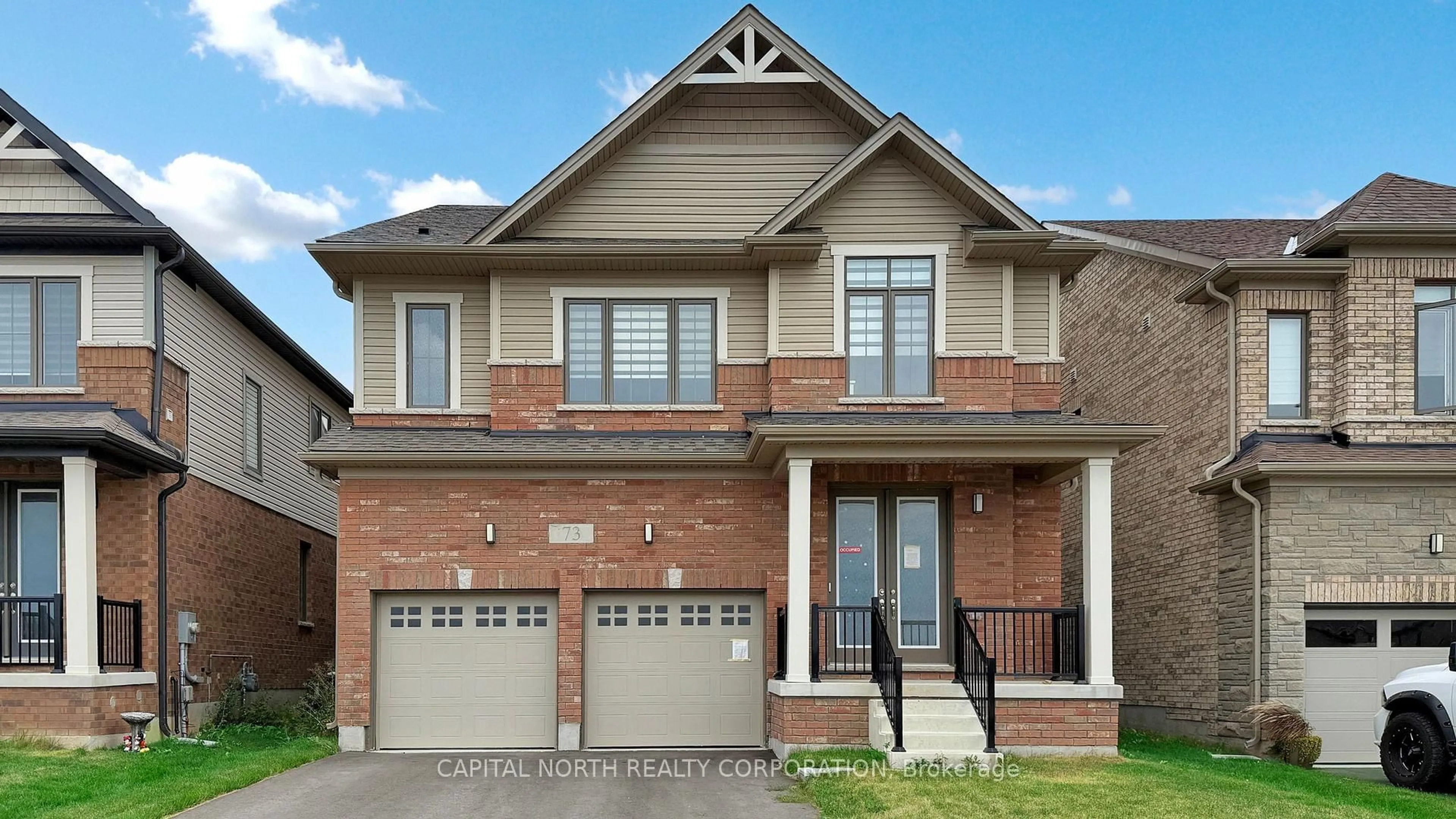 Home with brick exterior material, street for 73 Rustic Oak Tr, North Dumfries Ontario N0B 1E0
