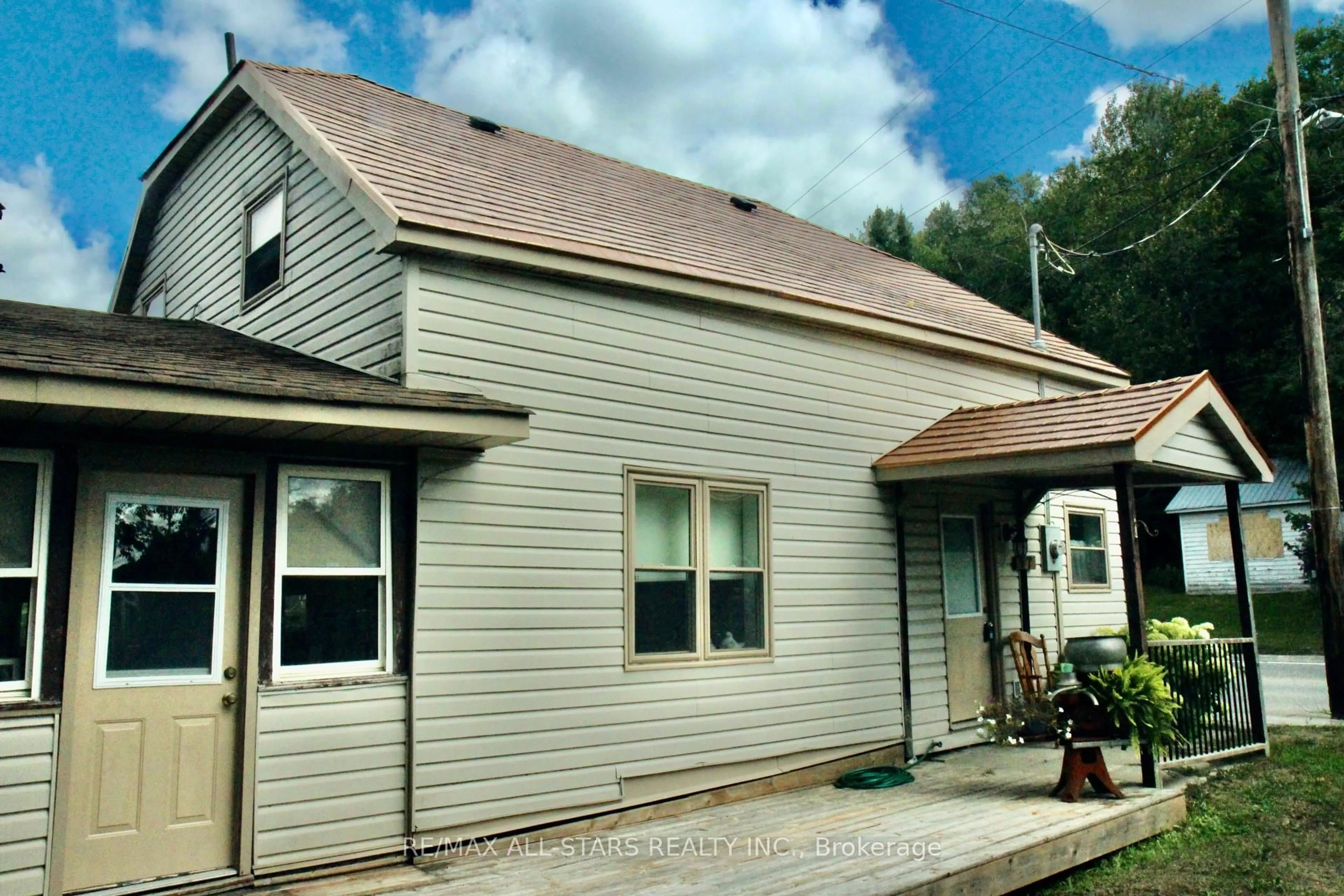 Home with vinyl exterior material, street for 77 Bobcaygeon Rd, Minden Hills Ontario K0M 2K0