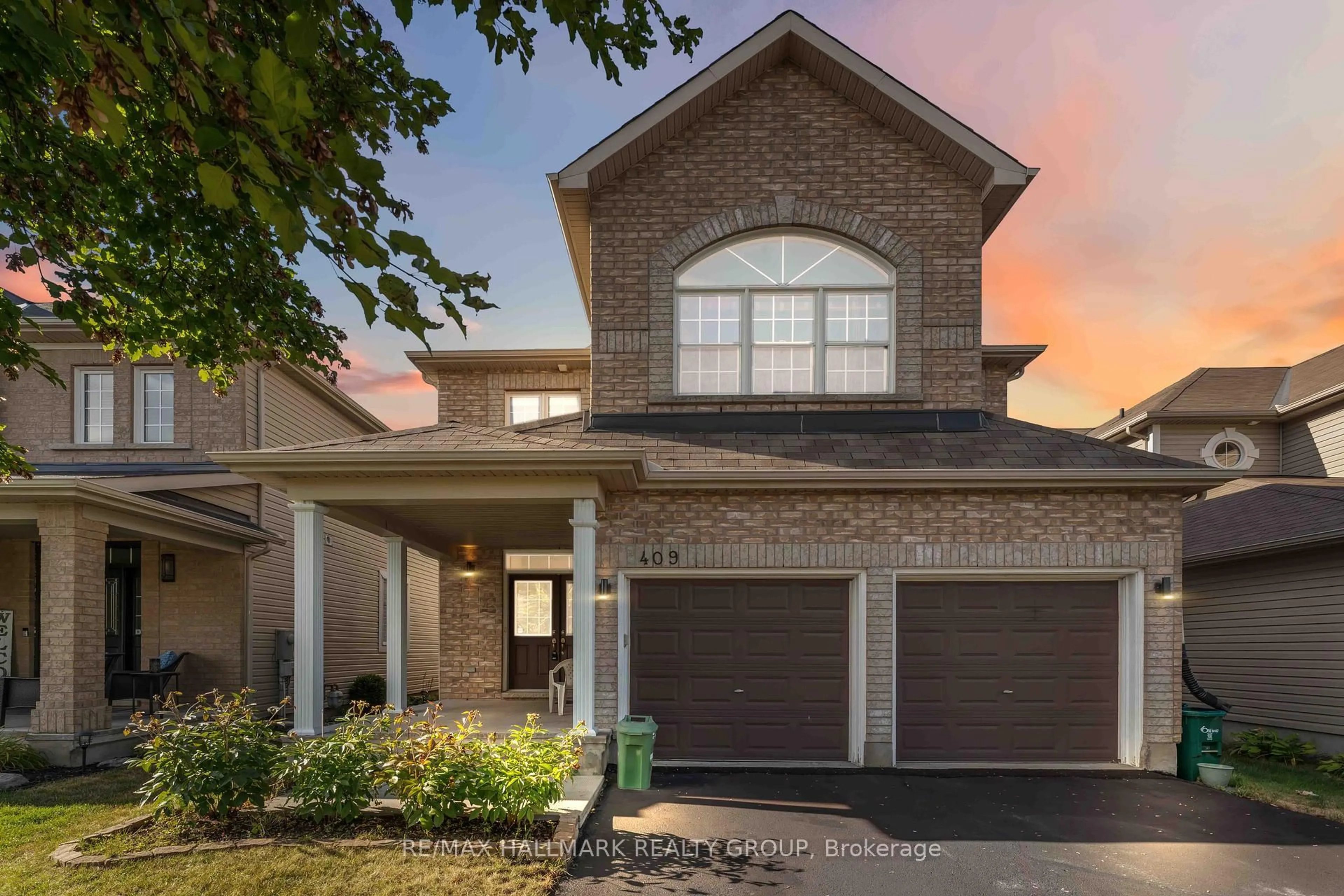Home with brick exterior material, street for 409 Tartaruga Lane, Ottawa Ontario K2J 0E2