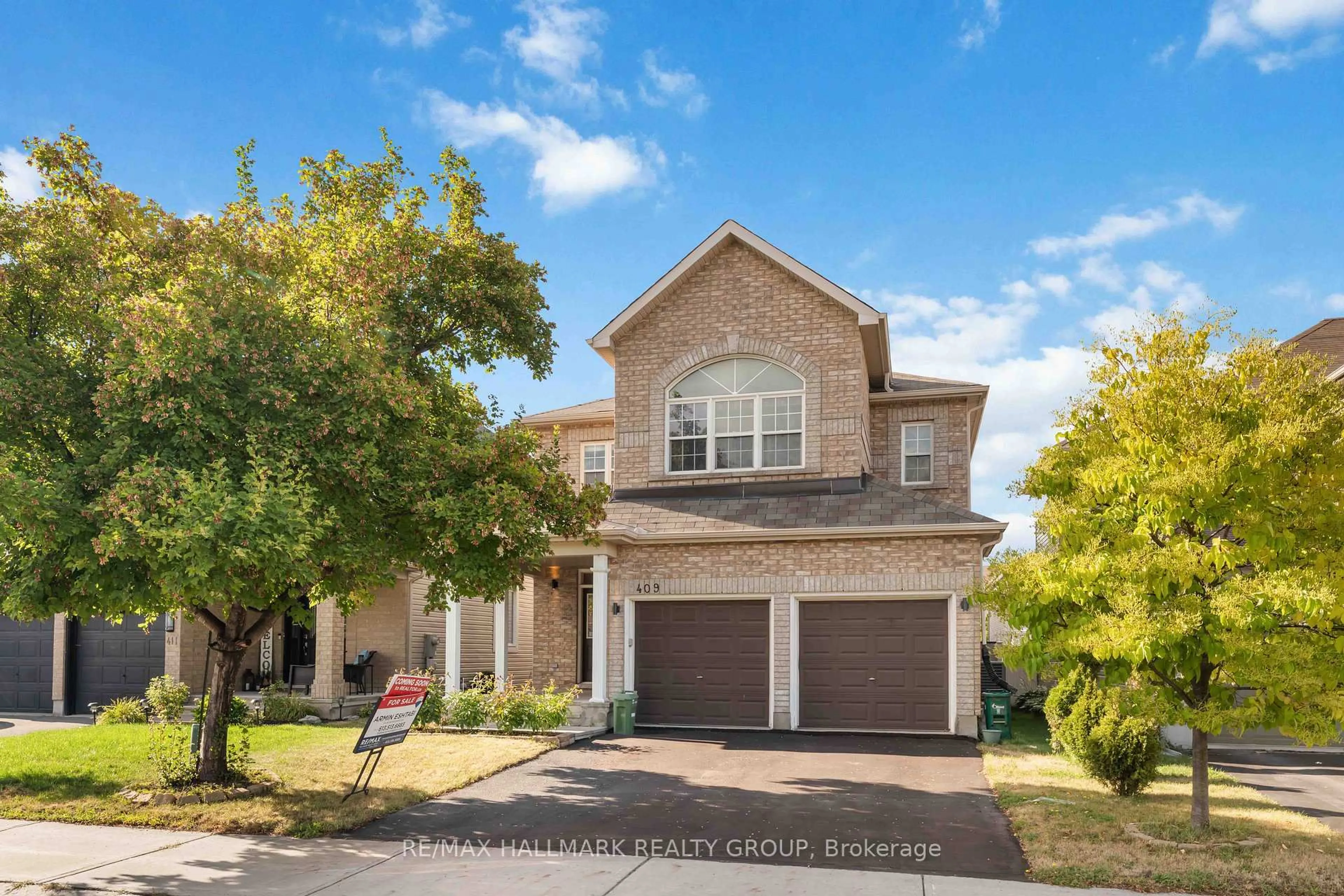 Home with brick exterior material, street for 409 Tartaruga Lane, Ottawa Ontario K2J 0E2