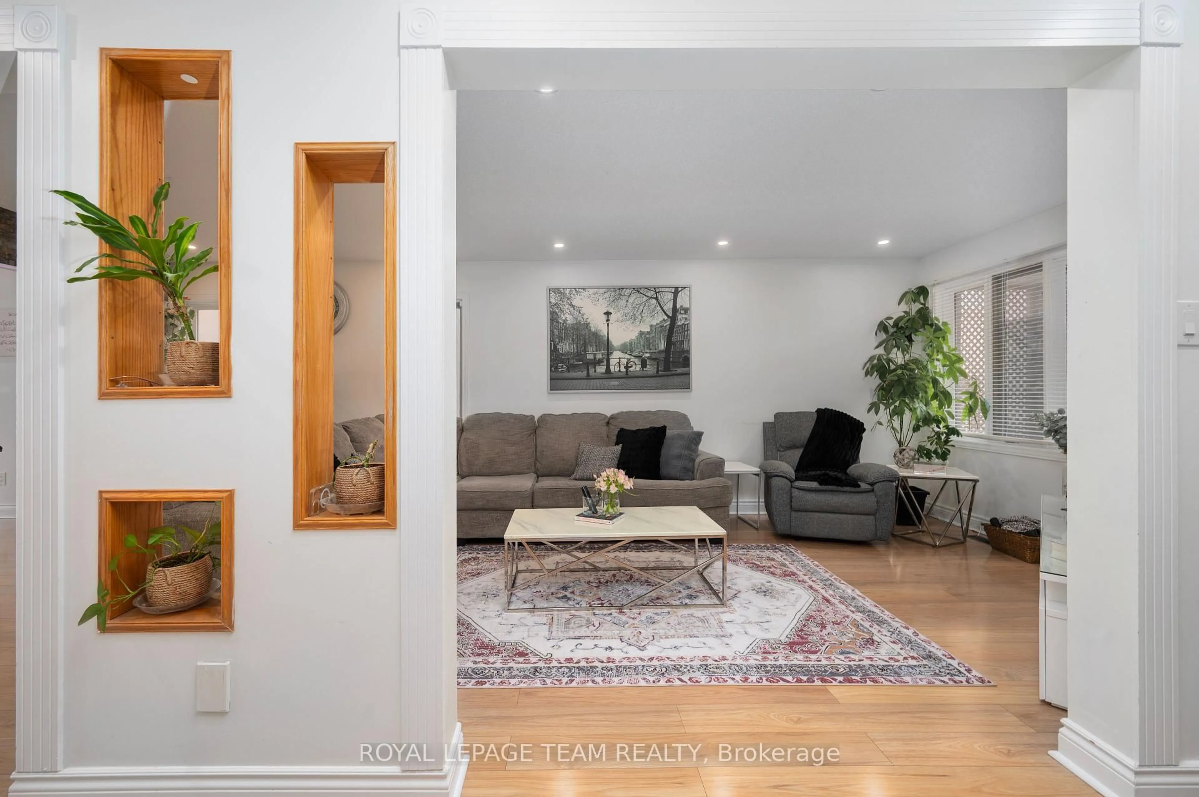 Living room with furniture, wood/laminate floor for 53 Havenhurst Cres, Ottawa Ontario K1T 3E8