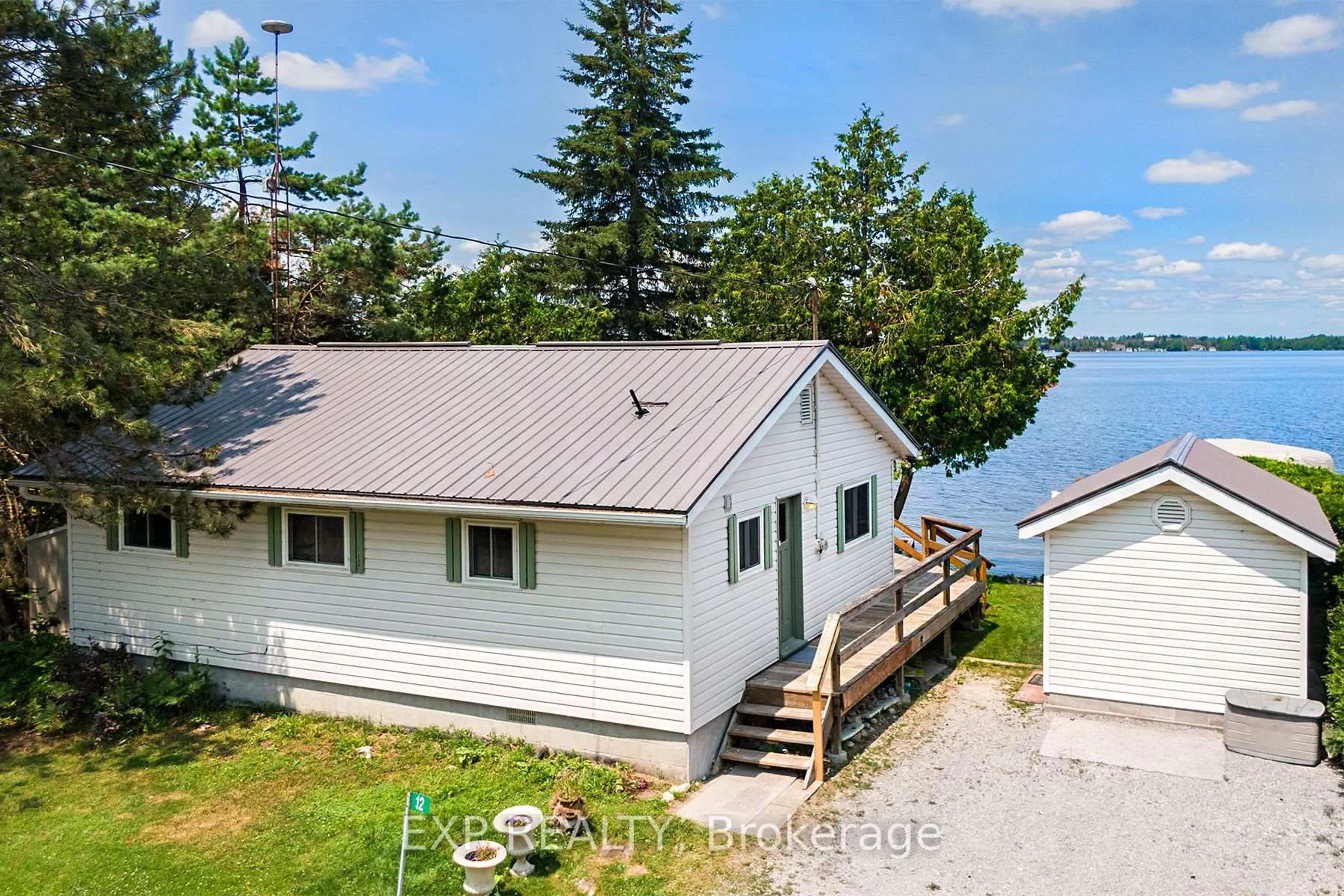A pic from outside/outdoor area/front of a property/back of a property/a pic from drone, water/lake/river/ocean view for 12 Cedar Point Rd, Kawartha Lakes Ontario K0M 1G0