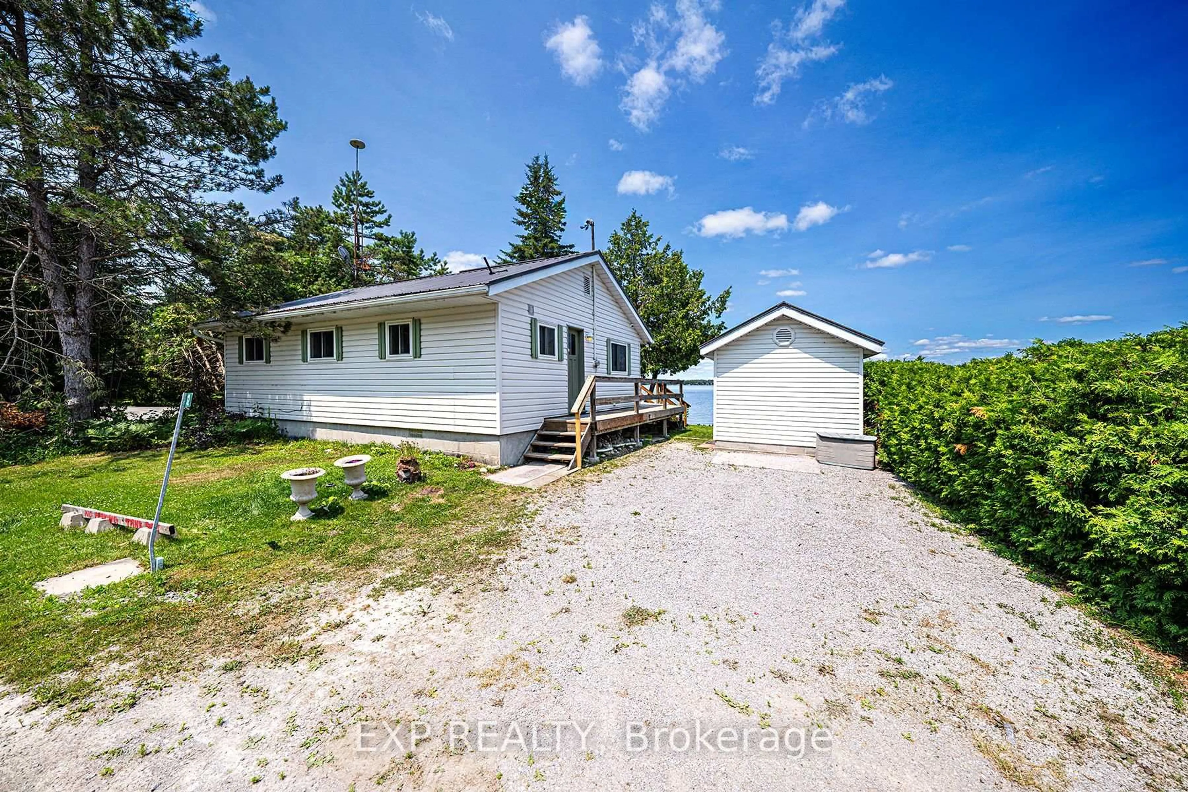 A pic from outside/outdoor area/front of a property/back of a property/a pic from drone, water/lake/river/ocean view for 12 Cedar Point Rd, Kawartha Lakes Ontario K0M 1G0