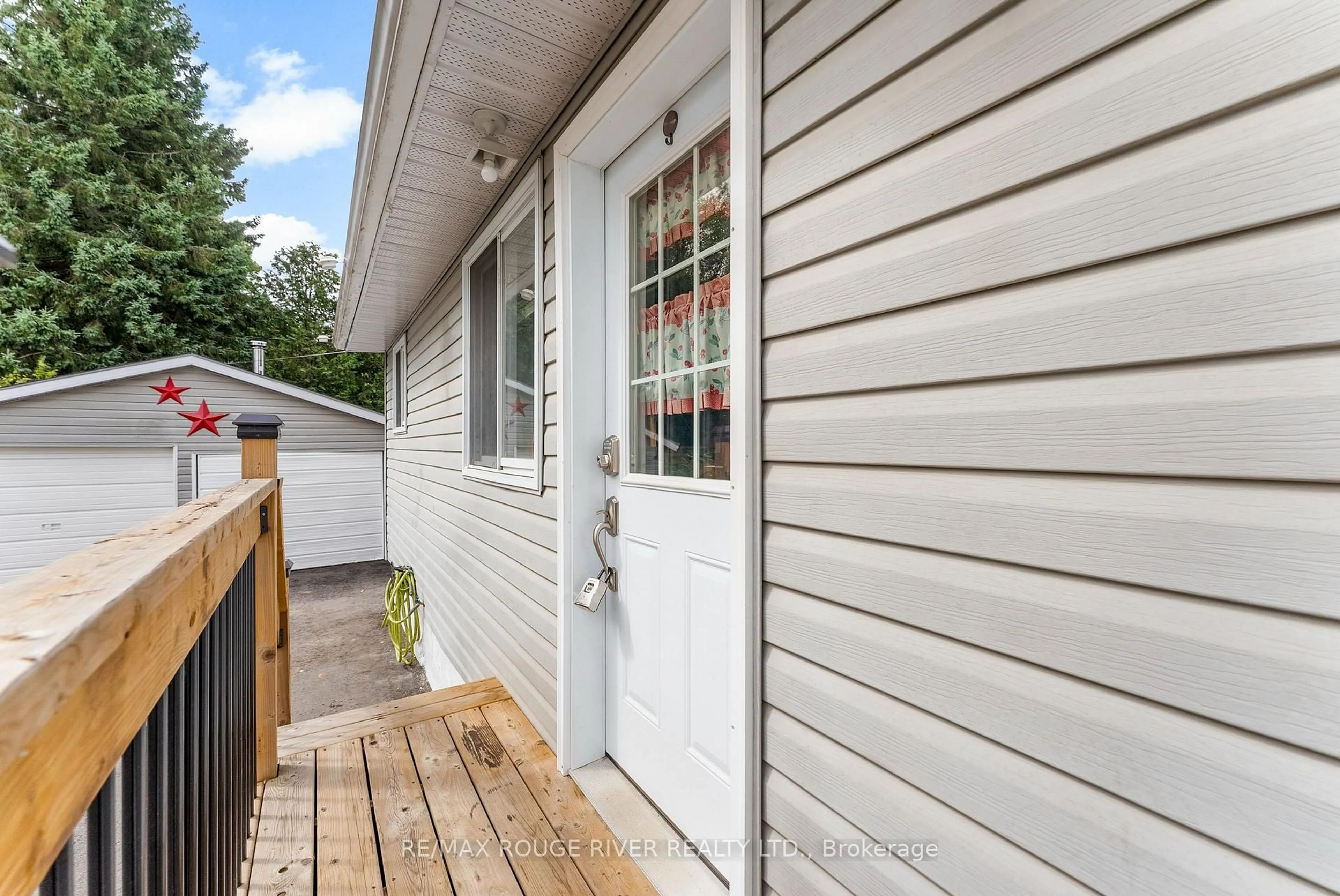 Home with vinyl exterior material, street for 3 Short St, Highlands East Ontario K0L 1M0