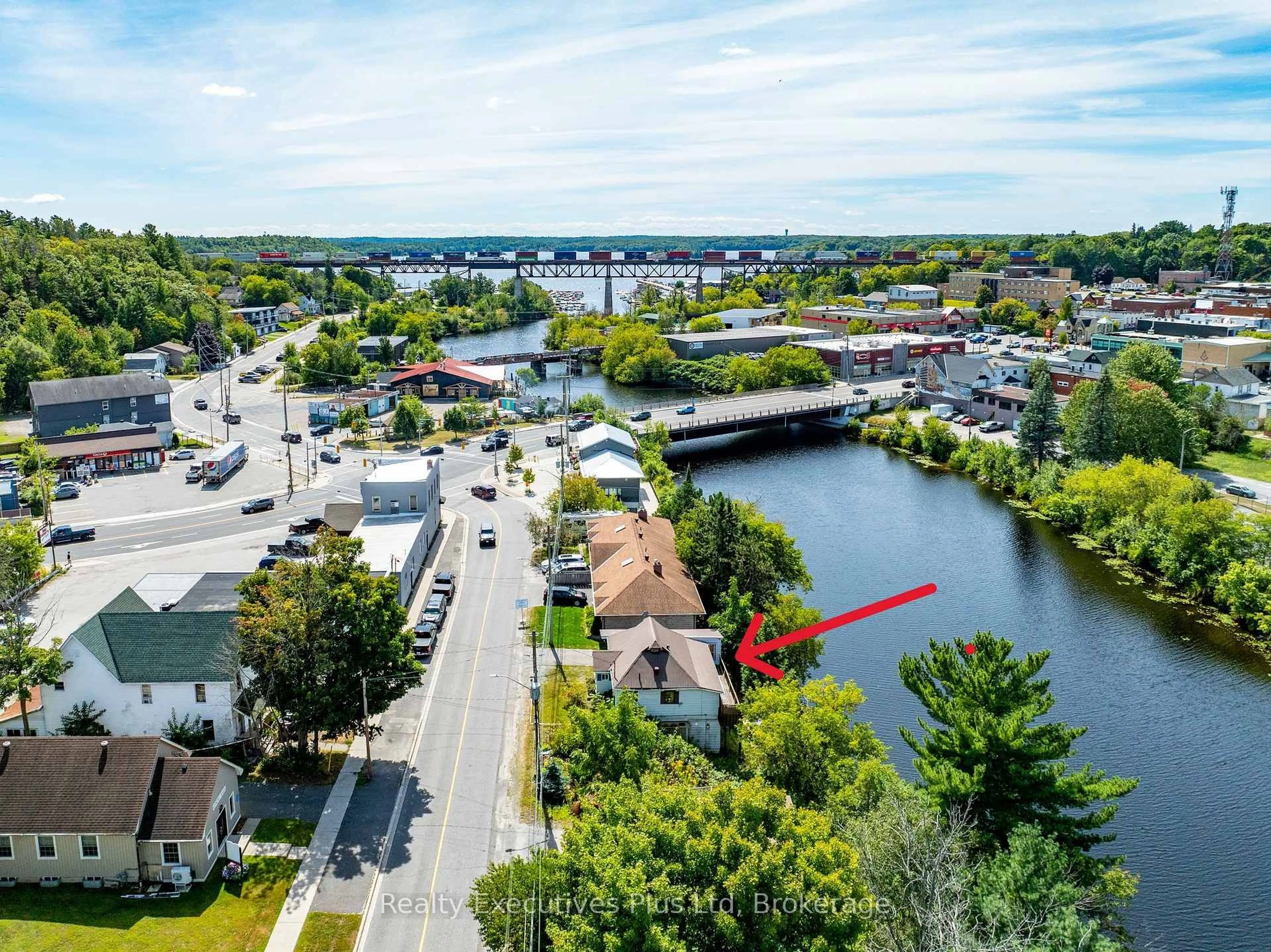 A pic from outside/outdoor area/front of a property/back of a property/a pic from drone, water/lake/river/ocean view for 12 River St, Parry Sound Ontario P2A 2T6