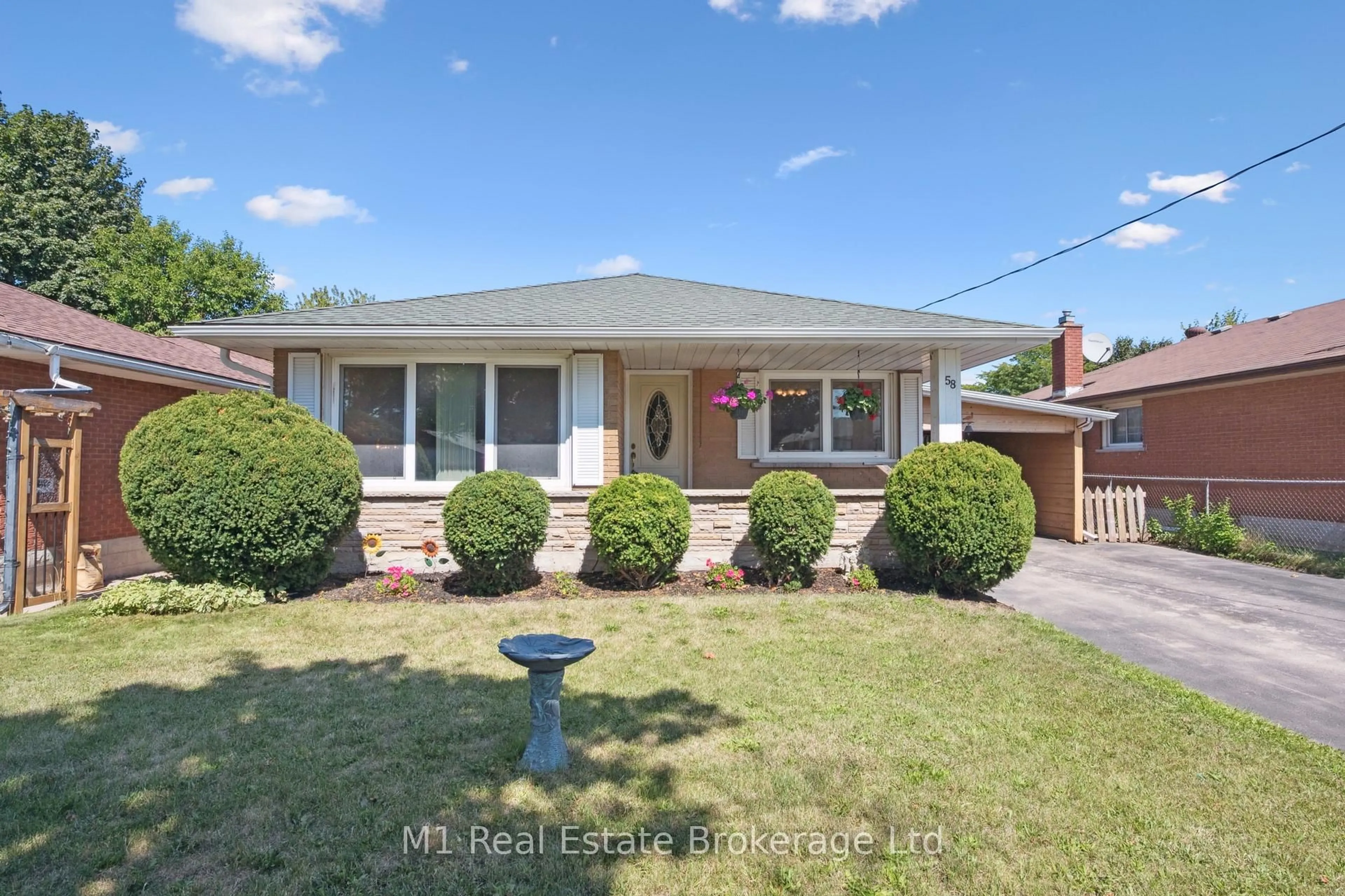 Home with brick exterior material, street for 58 Fairlawn Rd, Kitchener Ontario N2C 1X9