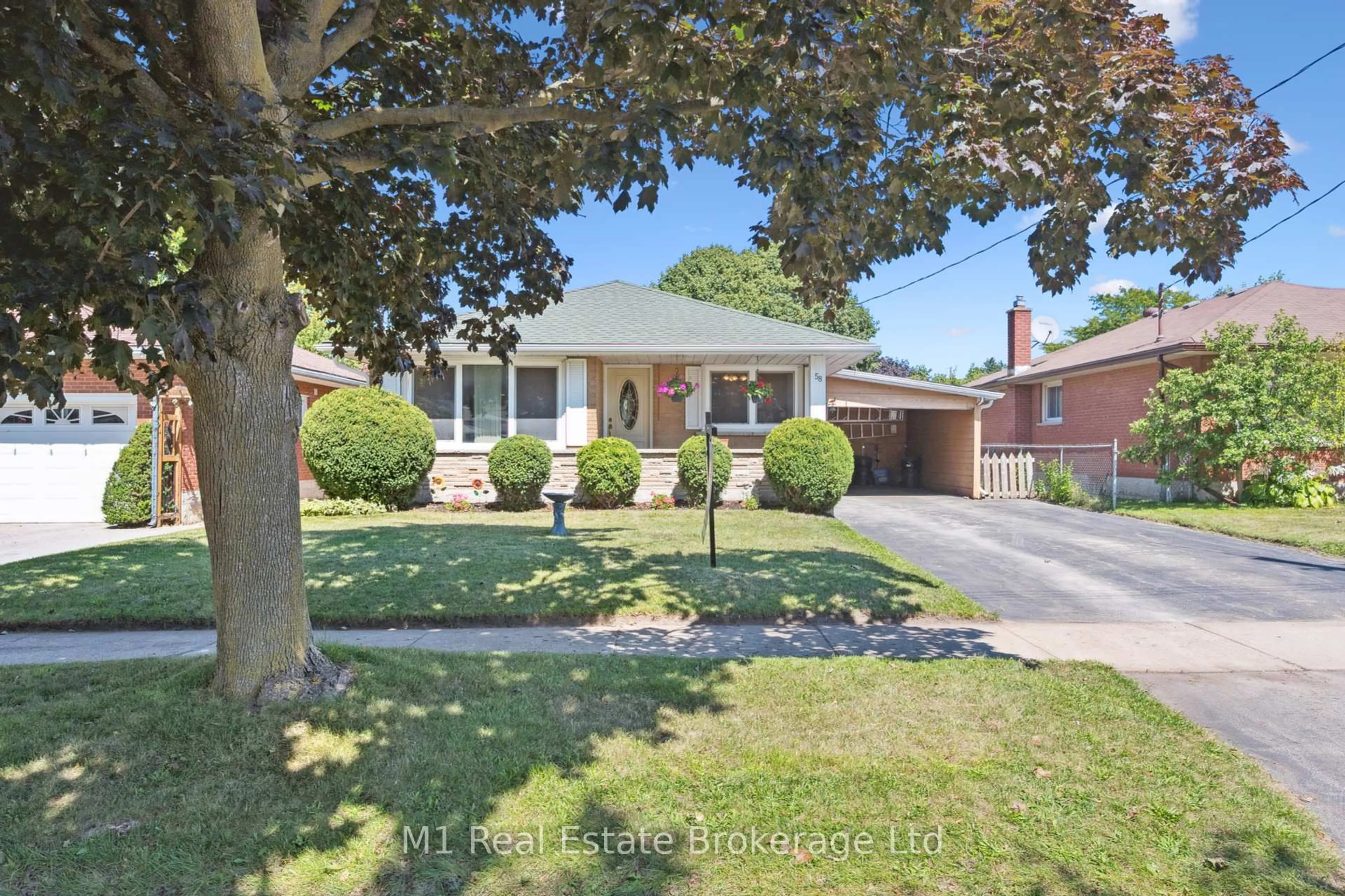 Home with brick exterior material, street for 58 Fairlawn Rd, Kitchener Ontario N2C 1X9