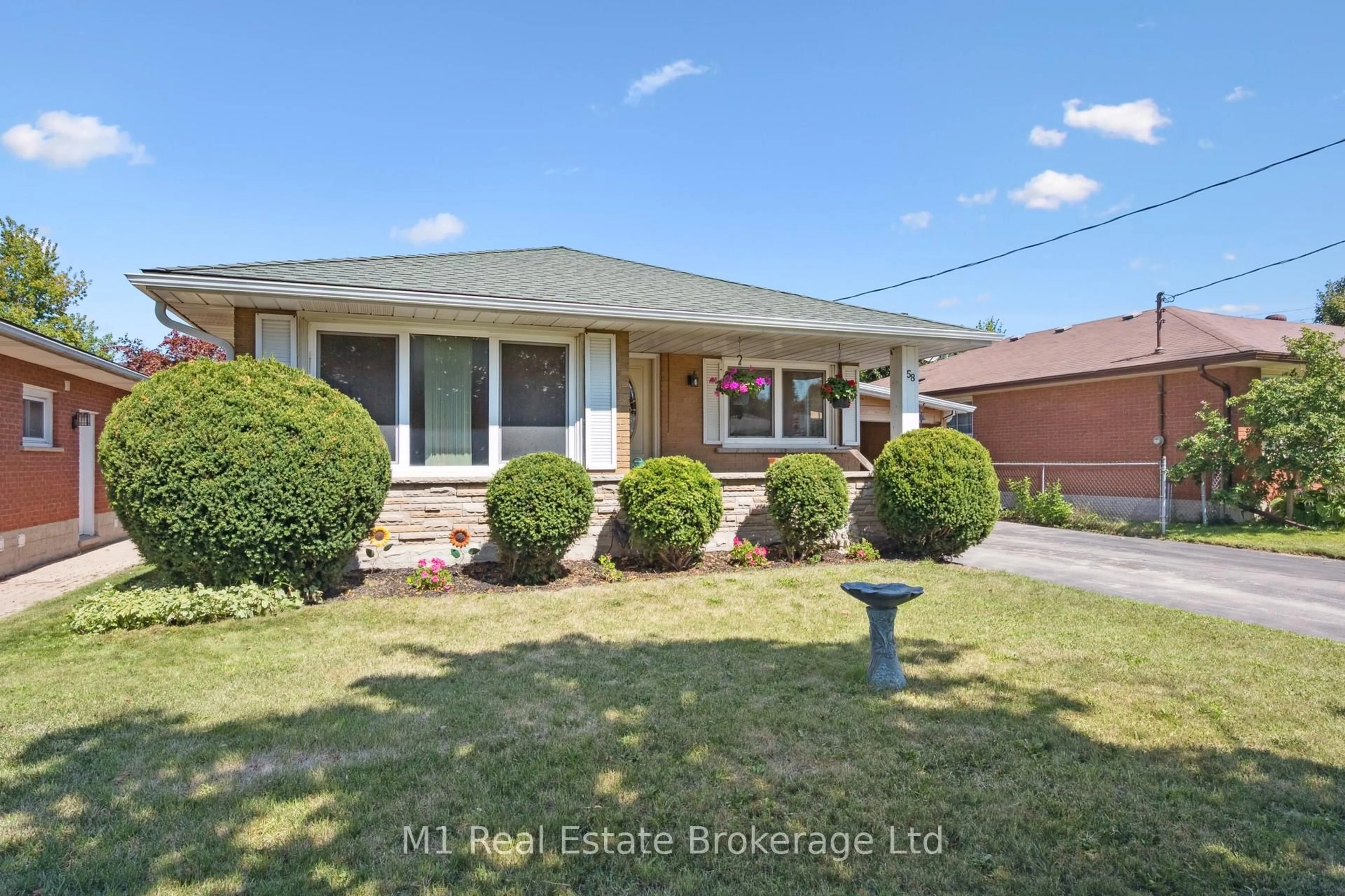 Home with brick exterior material, street for 58 Fairlawn Rd, Kitchener Ontario N2C 1X9