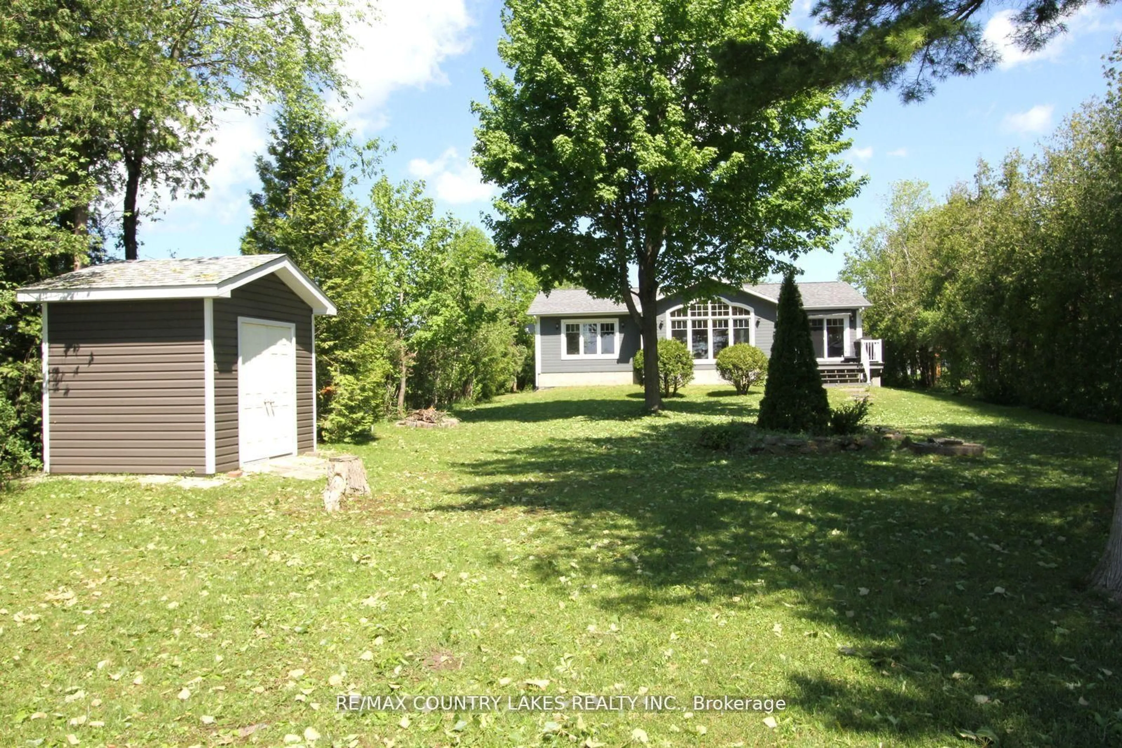 A pic from outside/outdoor area/front of a property/back of a property/a pic from drone, street for 275 Mcguire Beach Rd, Kawartha Lakes Ontario K0M 2B0