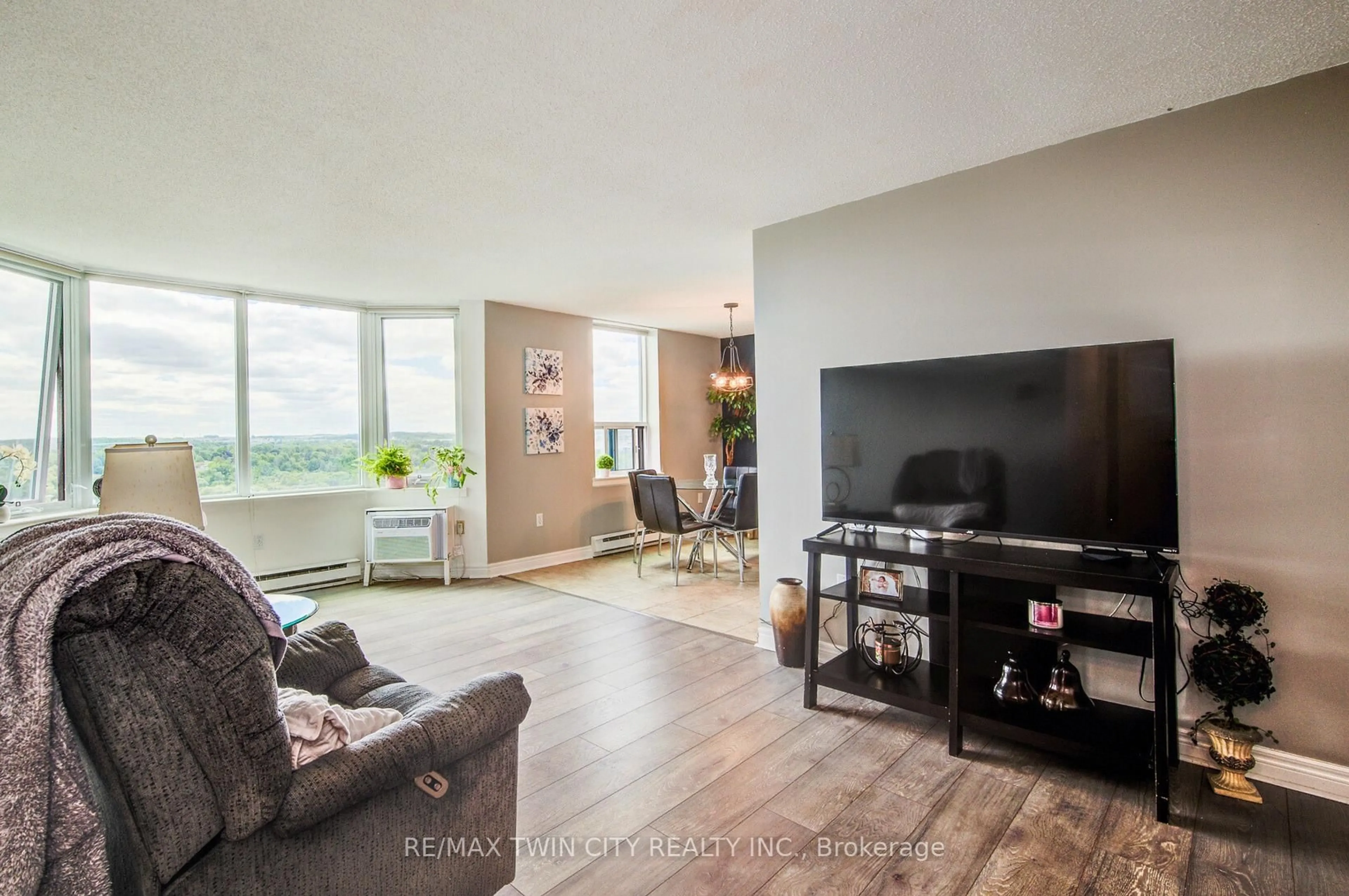 Living room with furniture, wood/laminate floor for 35 Green Valley Dr #1605, Kitchener Ontario N2P 2A5