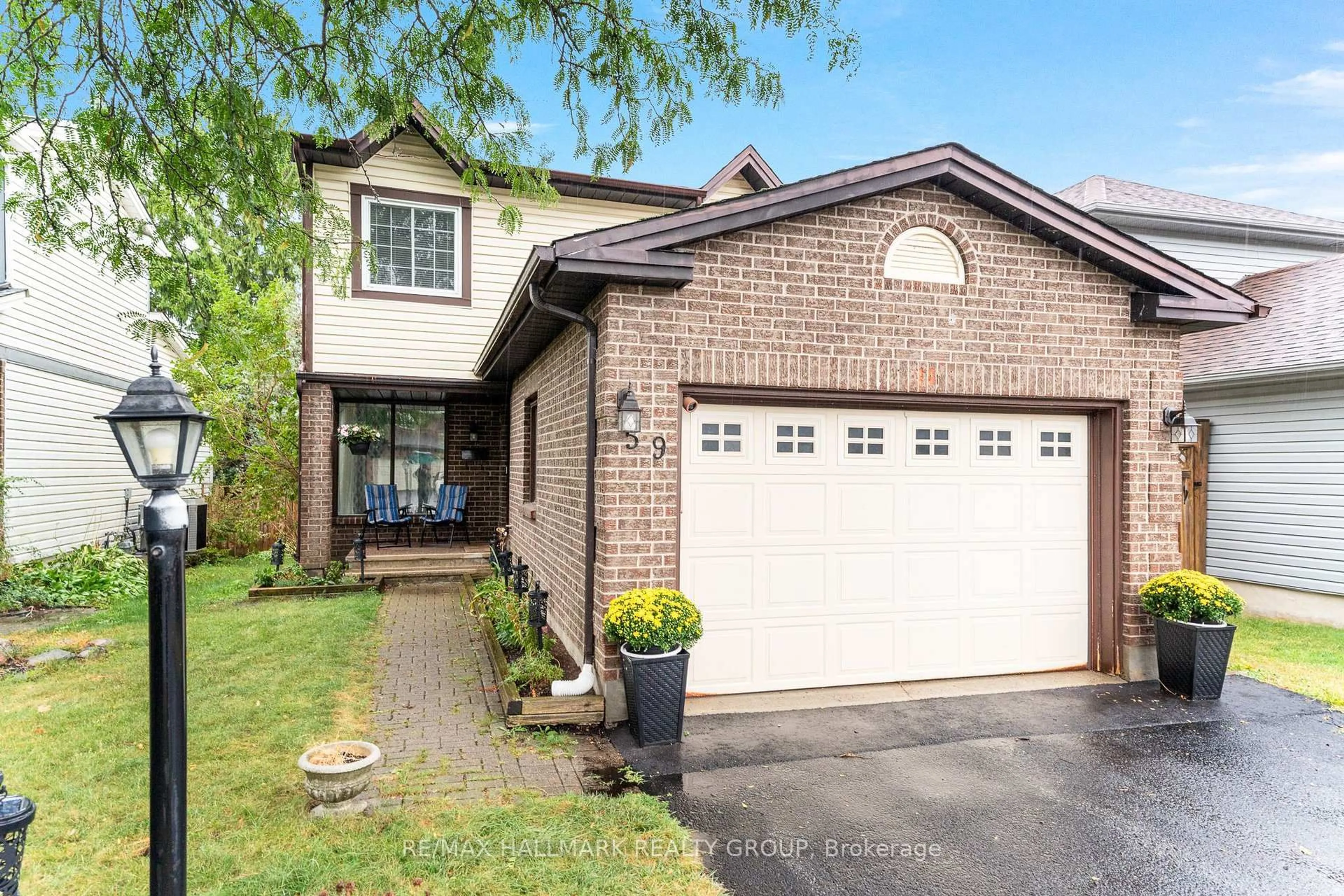 Home with brick exterior material, street for 59 Shearer Cres, Kanata Ontario K2L 3N3