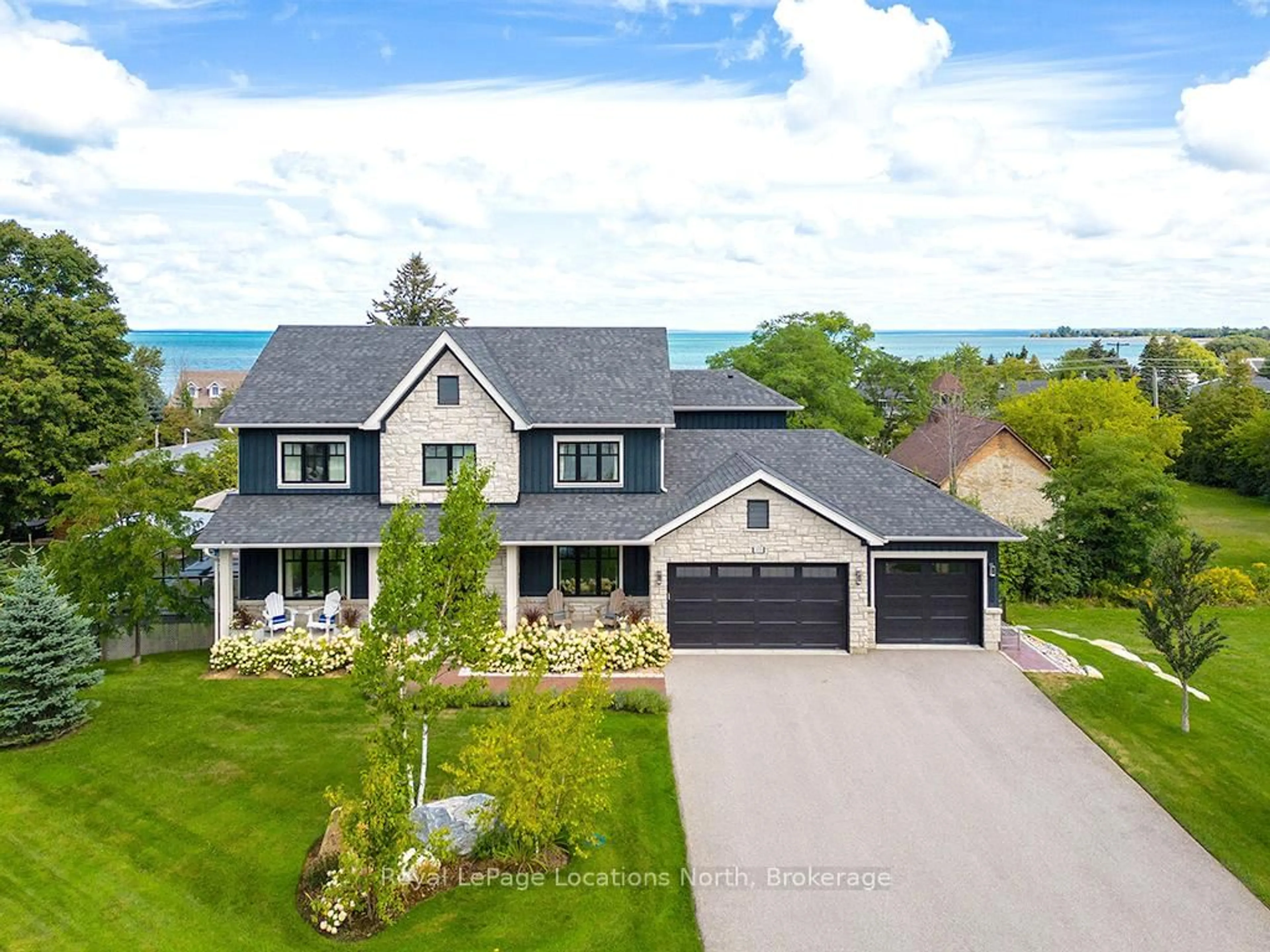 A pic from outside/outdoor area/front of a property/back of a property/a pic from drone, water/lake/river/ocean view for 117 SCHOOLHOUSE Crt, Blue Mountains Ontario L9Y 0N2