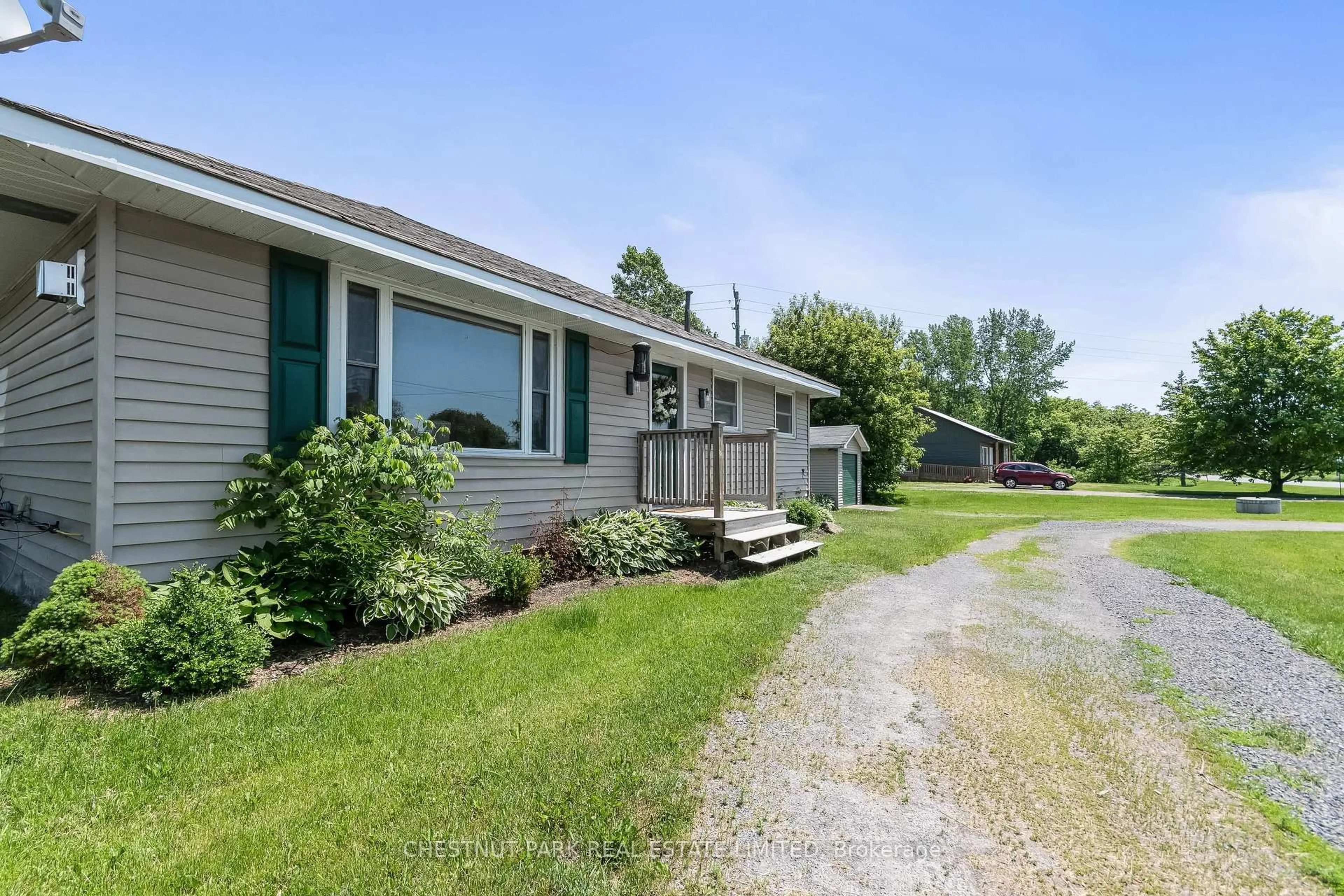 A pic from outside/outdoor area/front of a property/back of a property/a pic from drone, street for 1805 County Road 10, Prince Edward County Ontario K0K 1P0