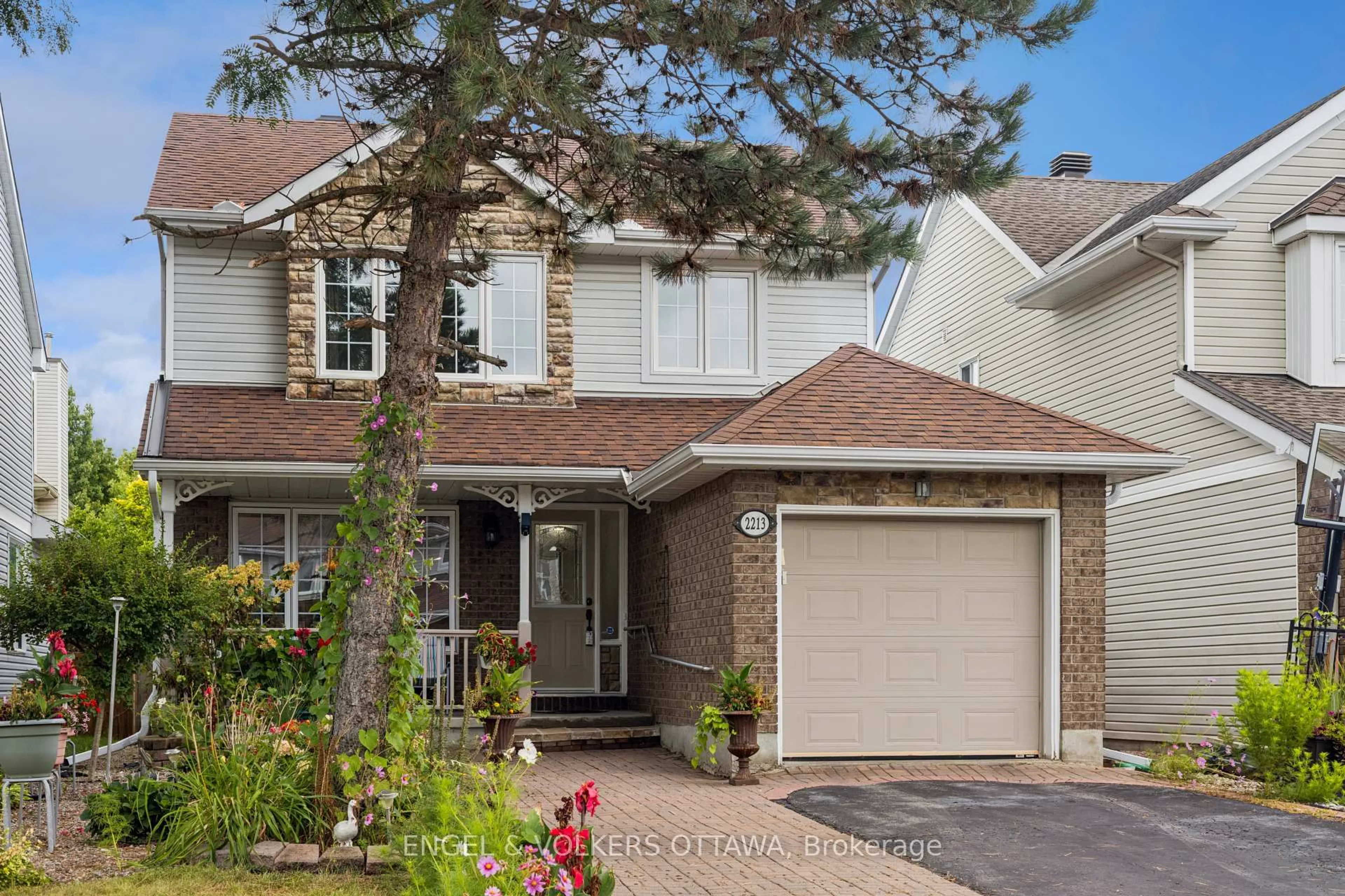 Home with vinyl exterior material, street for 2213 Noblewood Way, Ottawa Ontario K1W 1E7