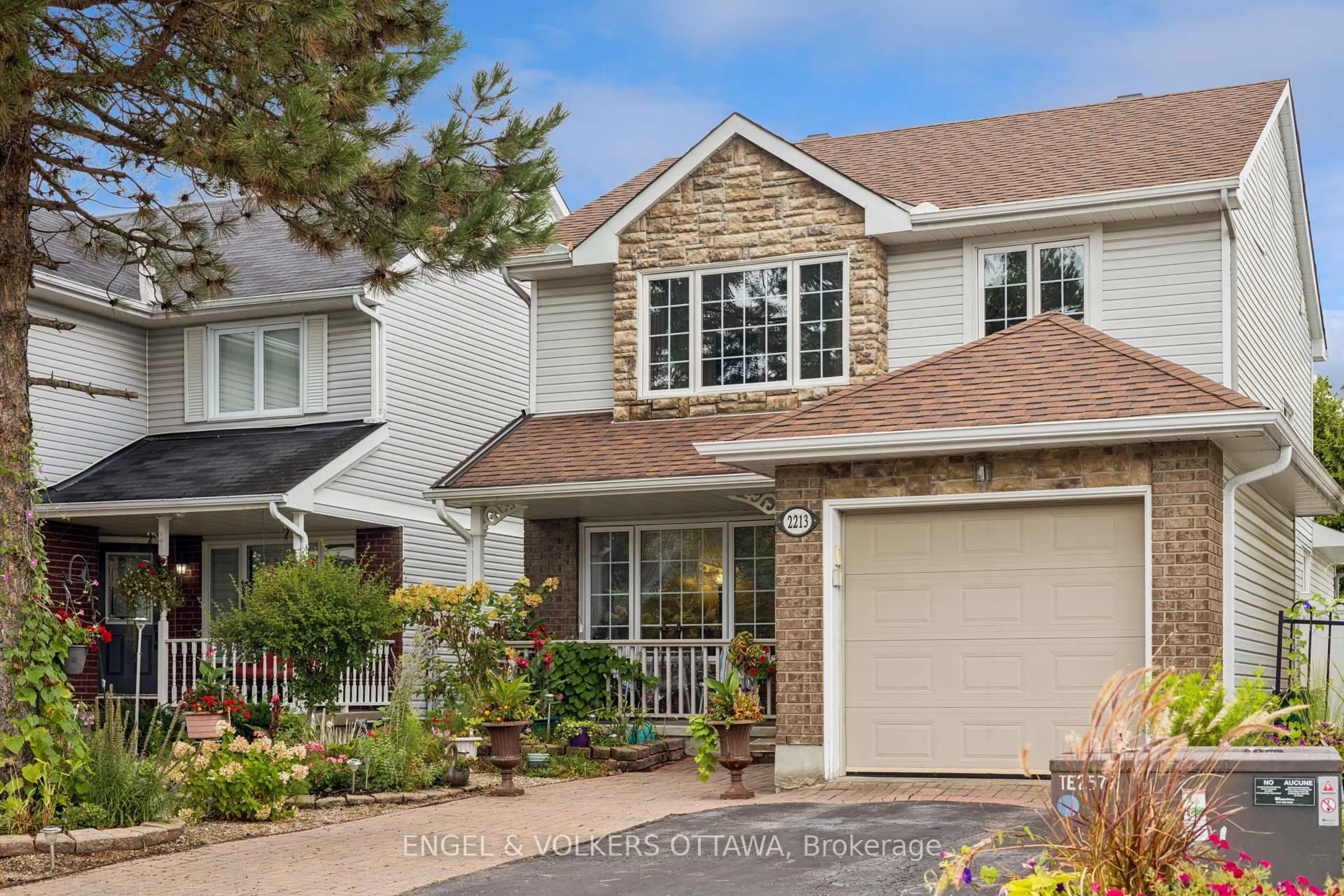 Home with vinyl exterior material, street for 2213 Noblewood Way, Ottawa Ontario K1W 1E7