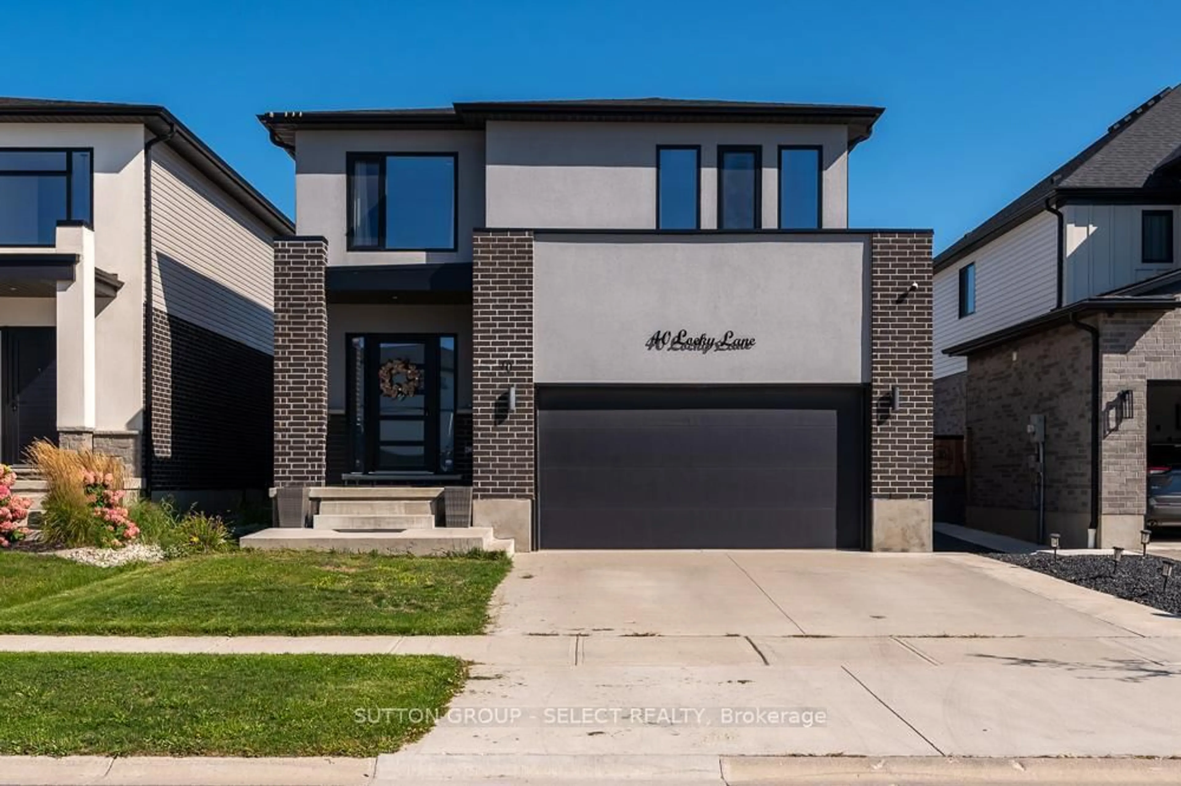 Home with brick exterior material, street for 40 Locky Lane, Middlesex Centre Ontario N0L 1R0