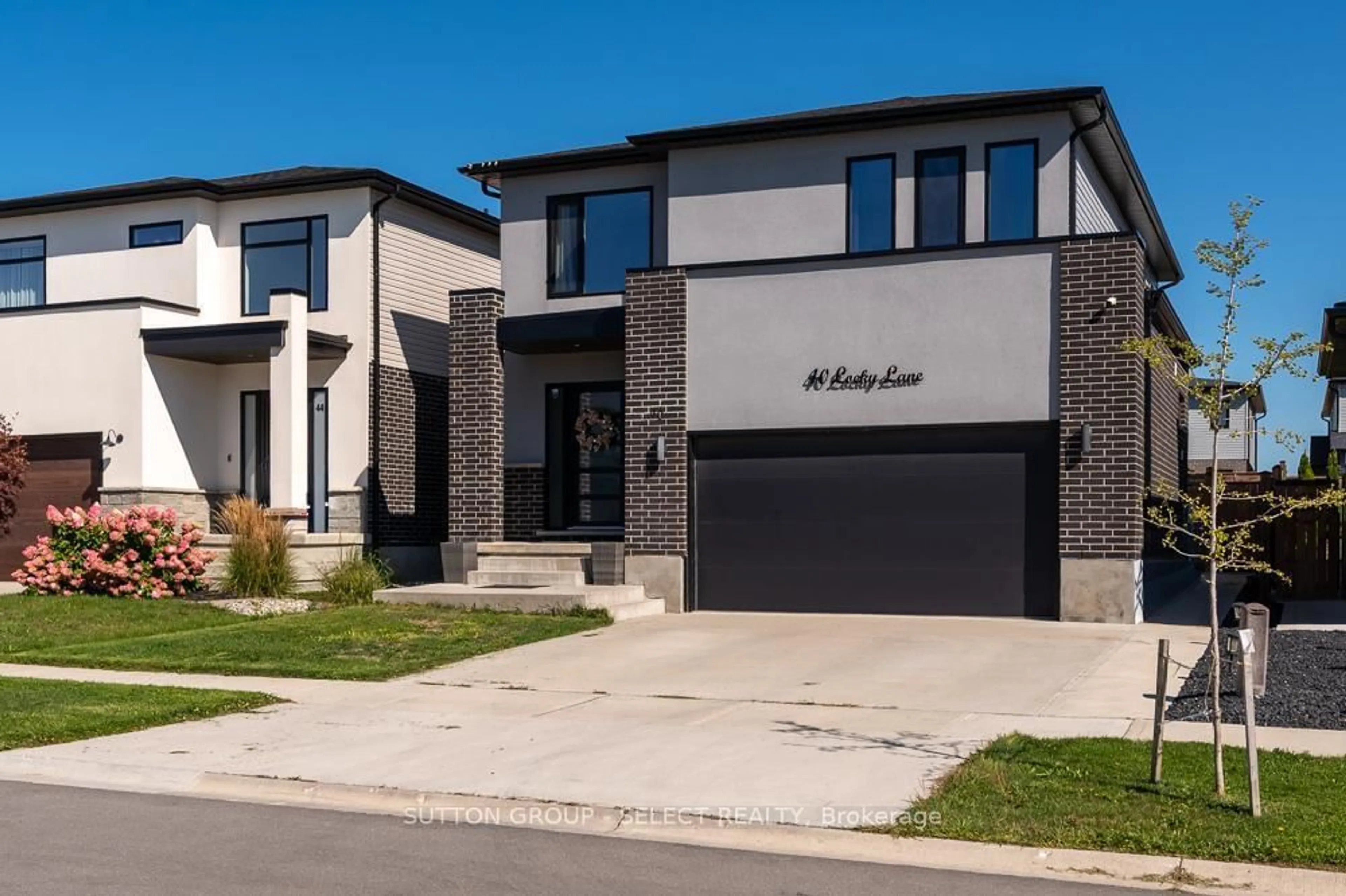 Home with brick exterior material, street for 40 Locky Lane, Middlesex Centre Ontario N0L 1R0