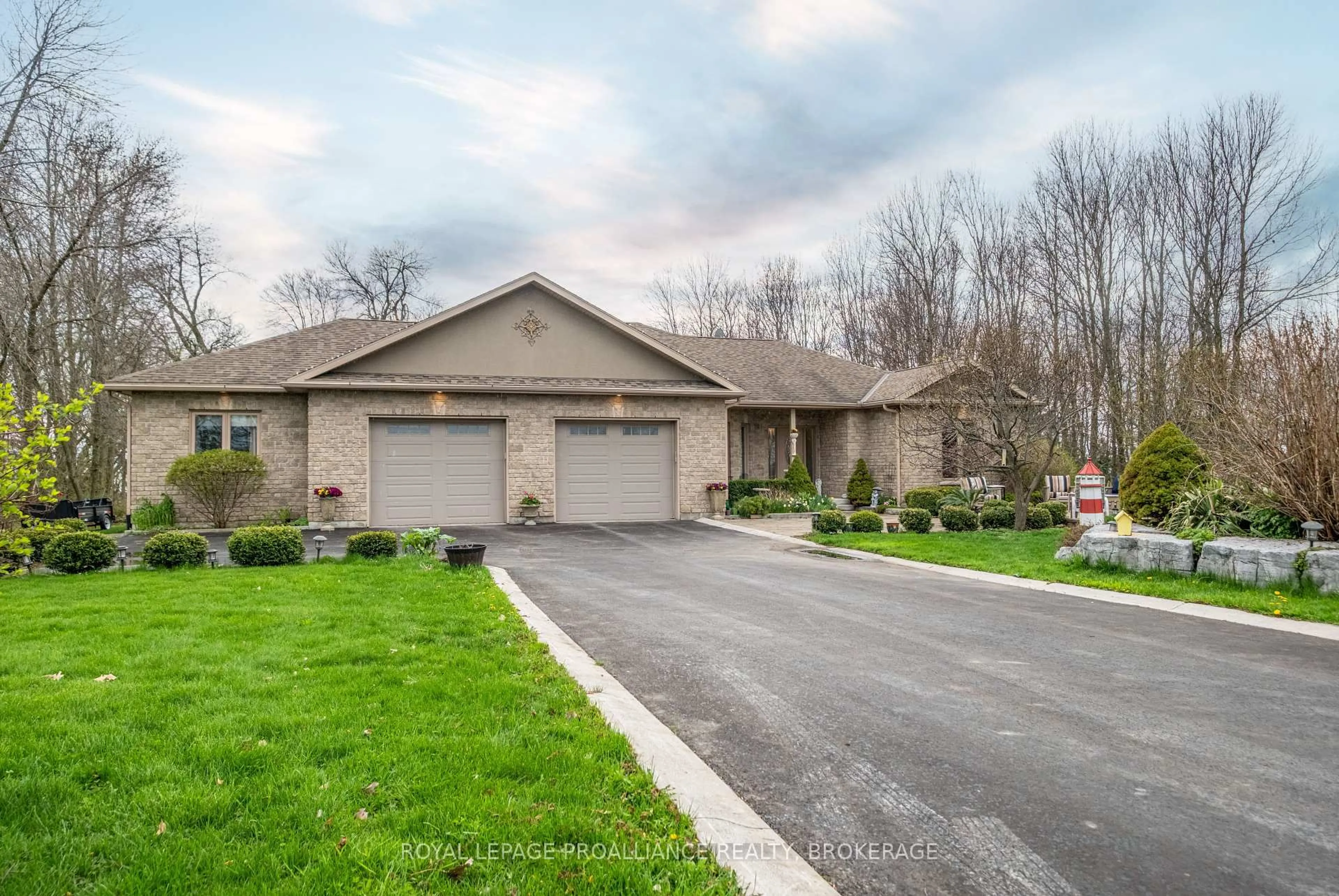 A pic from outside/outdoor area/front of a property/back of a property/a pic from drone, street for 12 Easy Lane, Wolfe Island Ontario K0H 2Y0