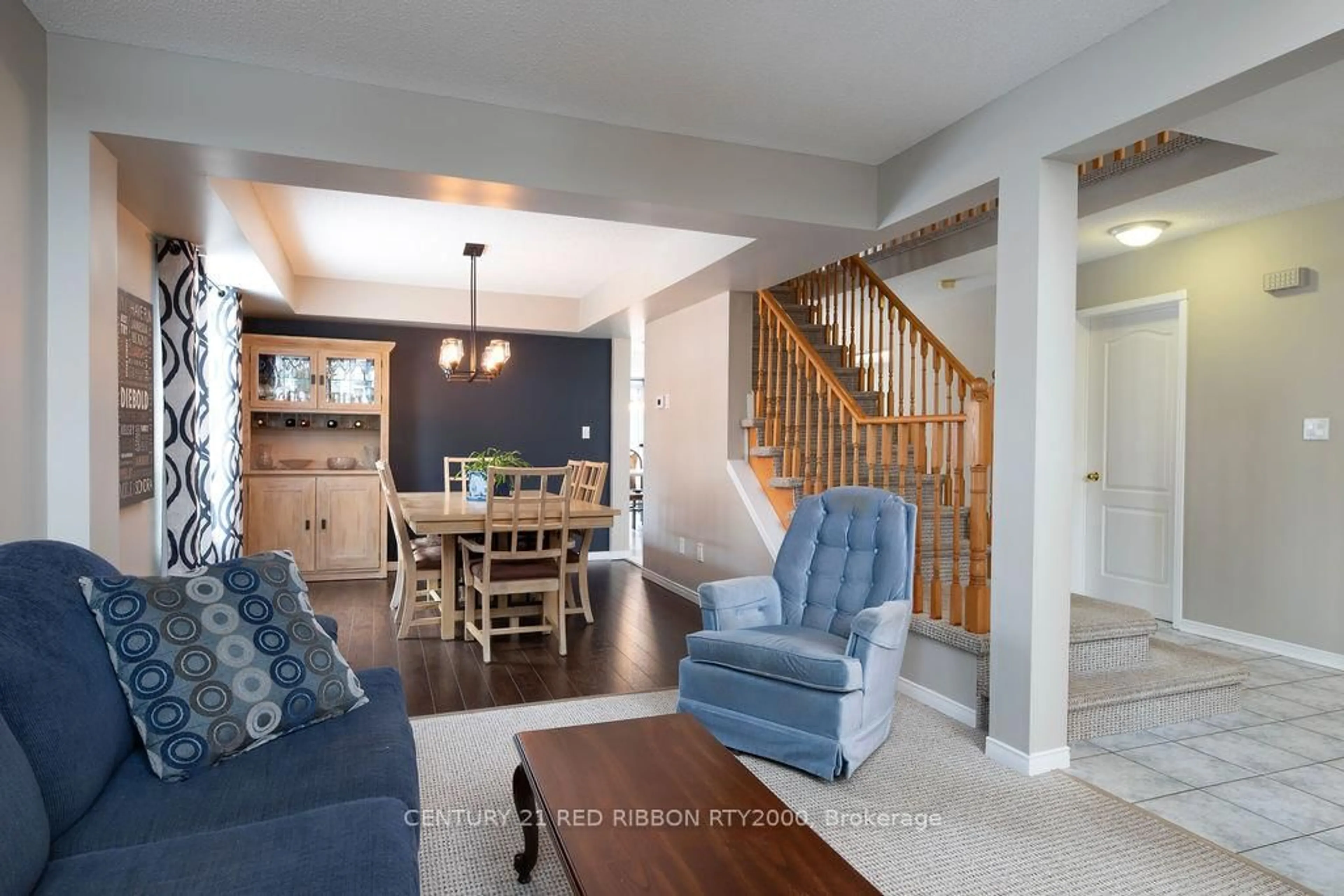 Living room with furniture, wood/laminate floor for 229 Marla Crt, Strathroy-Caradoc Ontario N7G 4L8