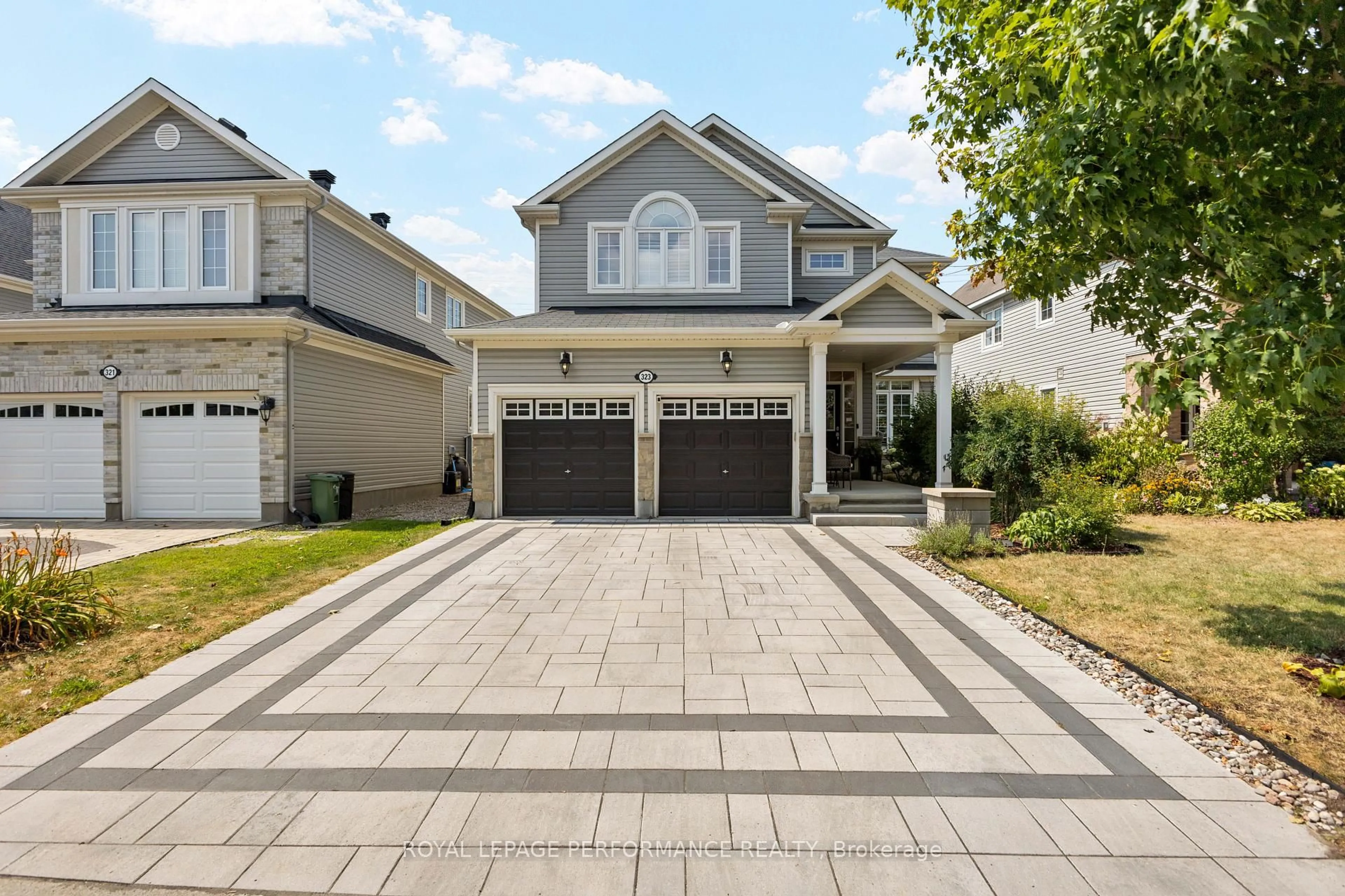 Home with vinyl exterior material, street for 323 Centerra Crt, Ottawa Ontario K2J 5T9