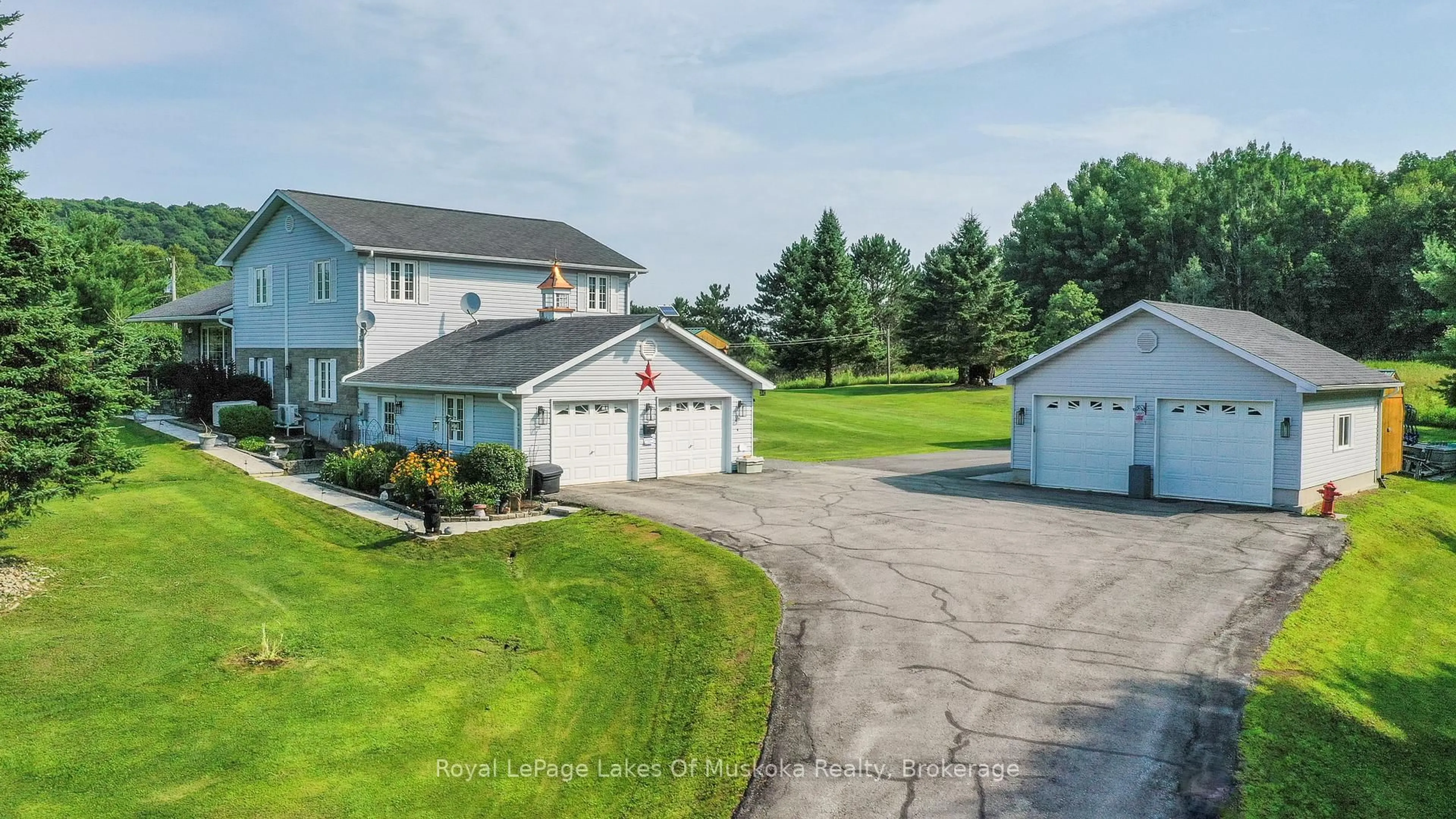 A pic from outside/outdoor area/front of a property/back of a property/a pic from drone, unknown for 284 South Fairy Lake Rd, Huntsville Ontario P1H 1R5