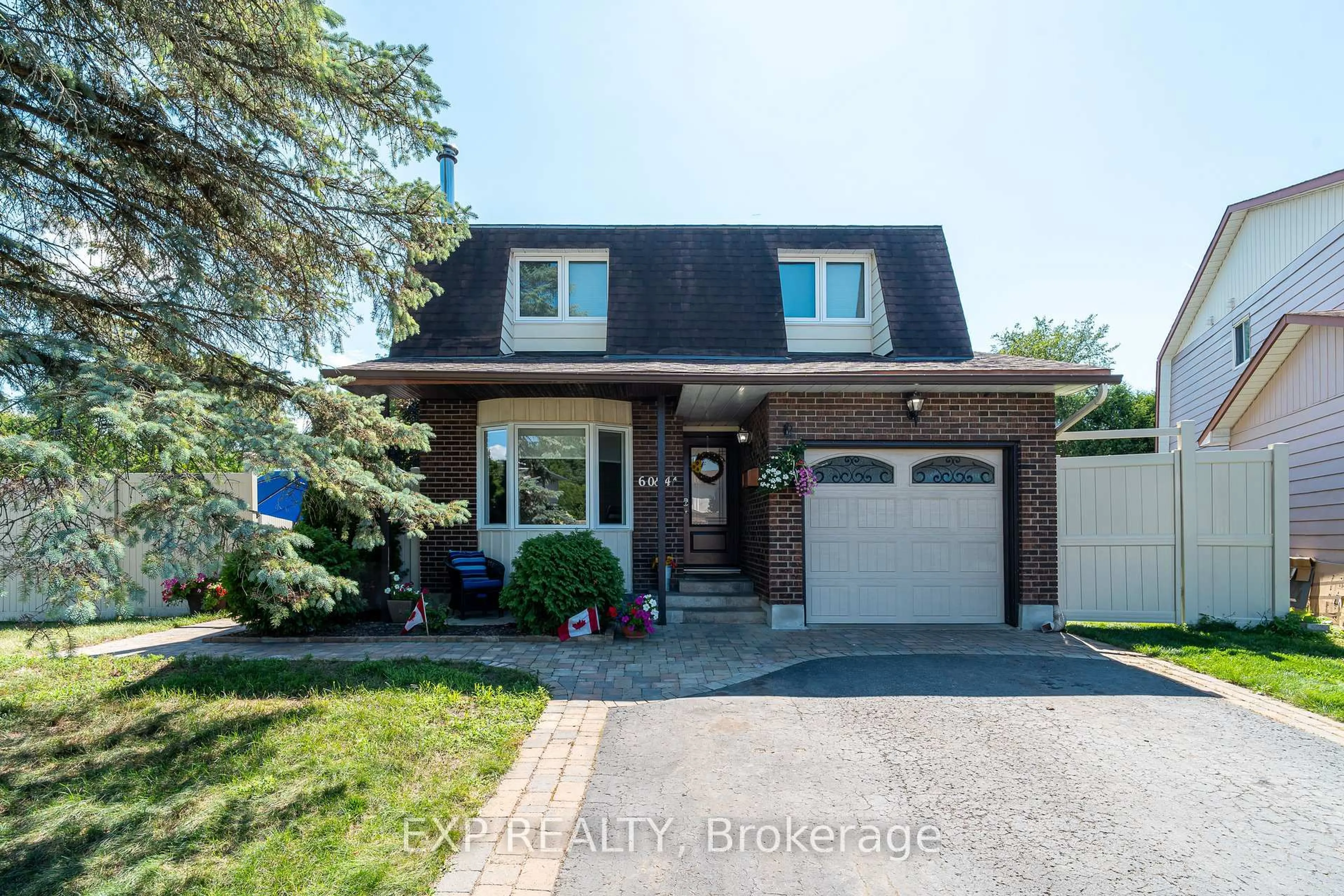 Home with brick exterior material, street for 6084A Vineyard Dr, Ottawa Ontario K1C 2M5