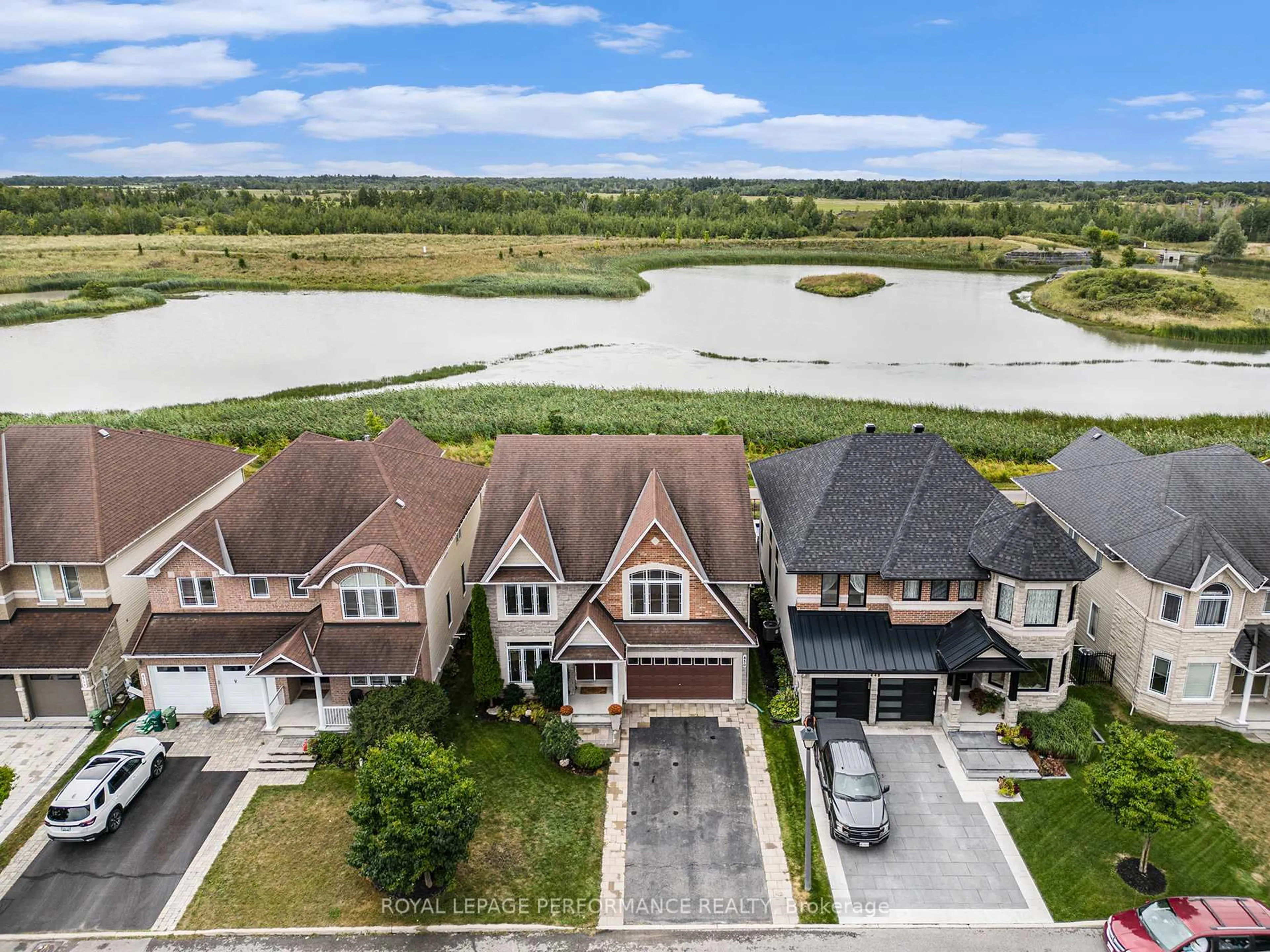 A pic from outside/outdoor area/front of a property/back of a property/a pic from drone, water/lake/river/ocean view for 450 Frank Cauley Way, Orleans Ontario K4A 0L5