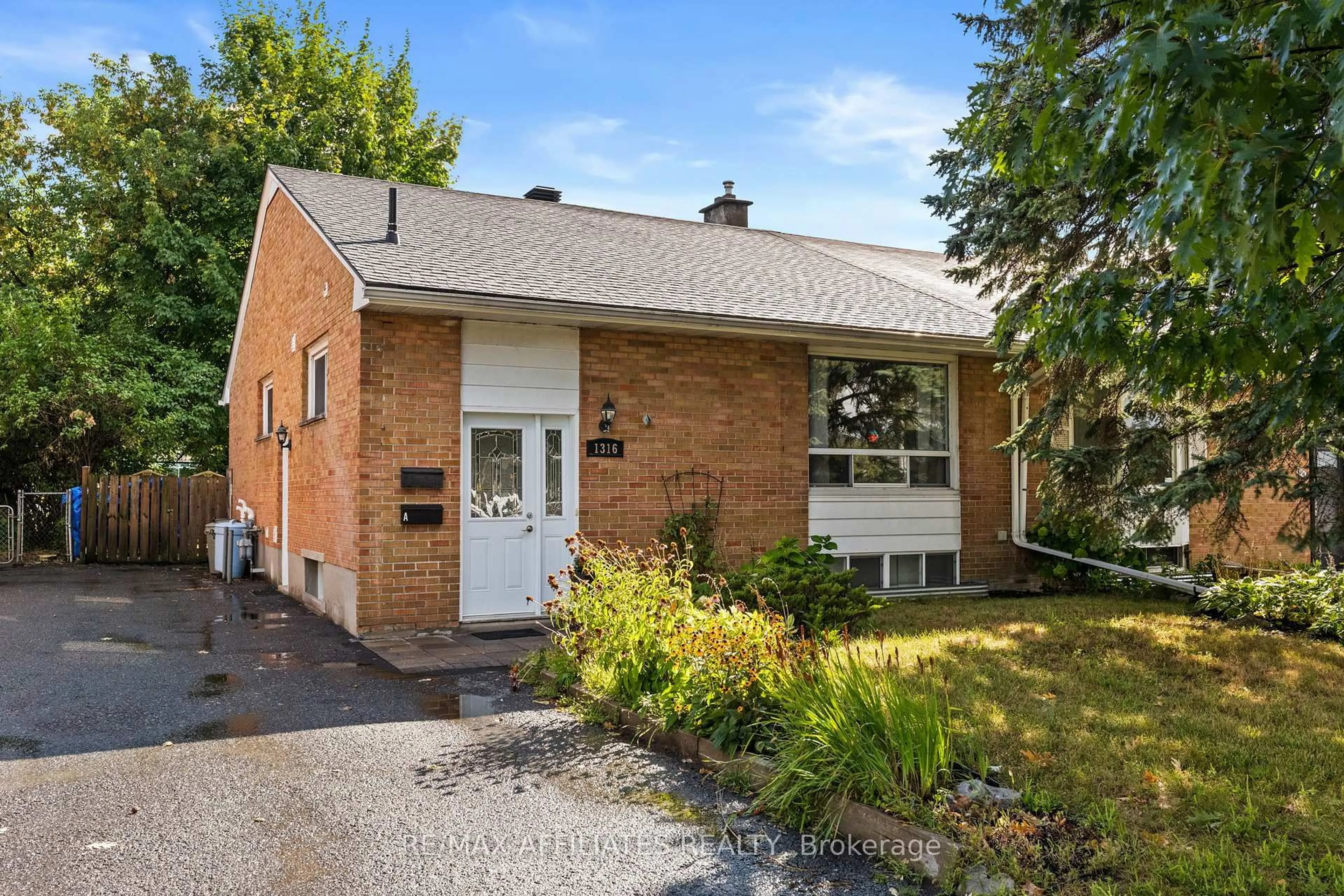 Home with brick exterior material, street for 1316 Bloomsbury Cres, Ottawa Ontario K2C 2Y9