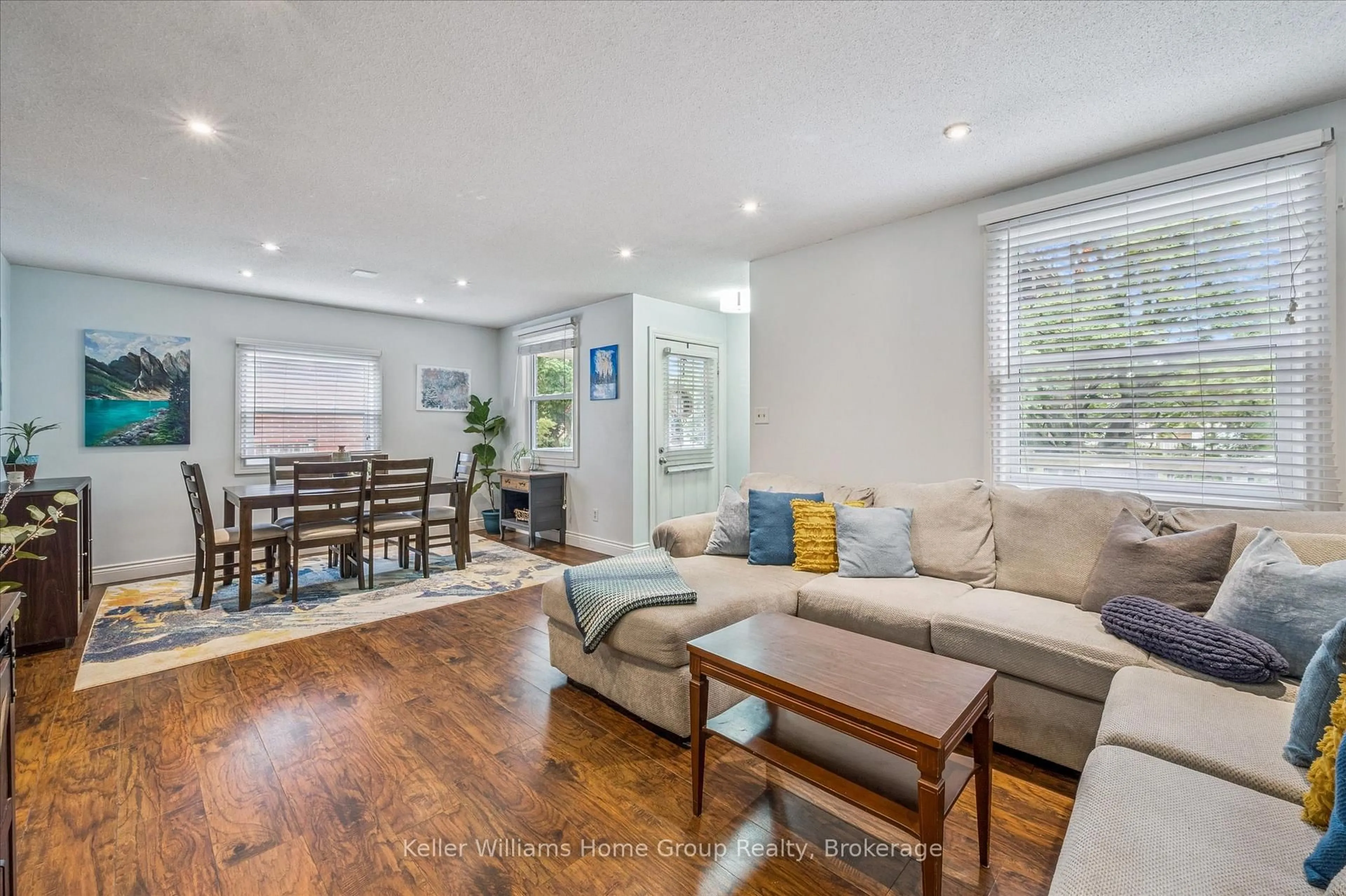Living room with furniture, wood/laminate floor for 1138 Langs Circ, Cambridge Ontario N3H 5E6