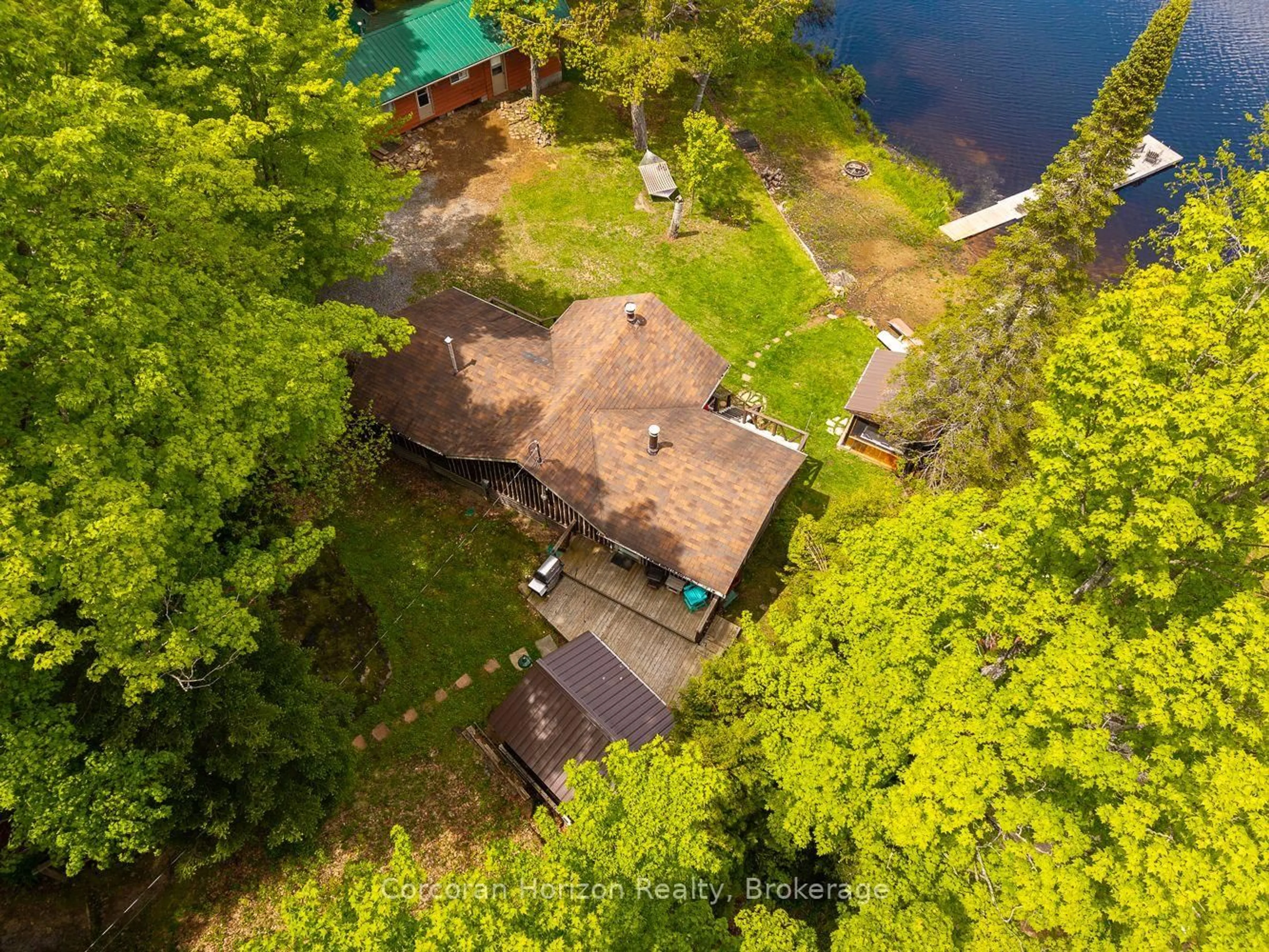 A pic from outside/outdoor area/front of a property/back of a property/a pic from drone, water/lake/river/ocean view for 247 Mainhood Rd, Huntsville Ontario P0B 1M0