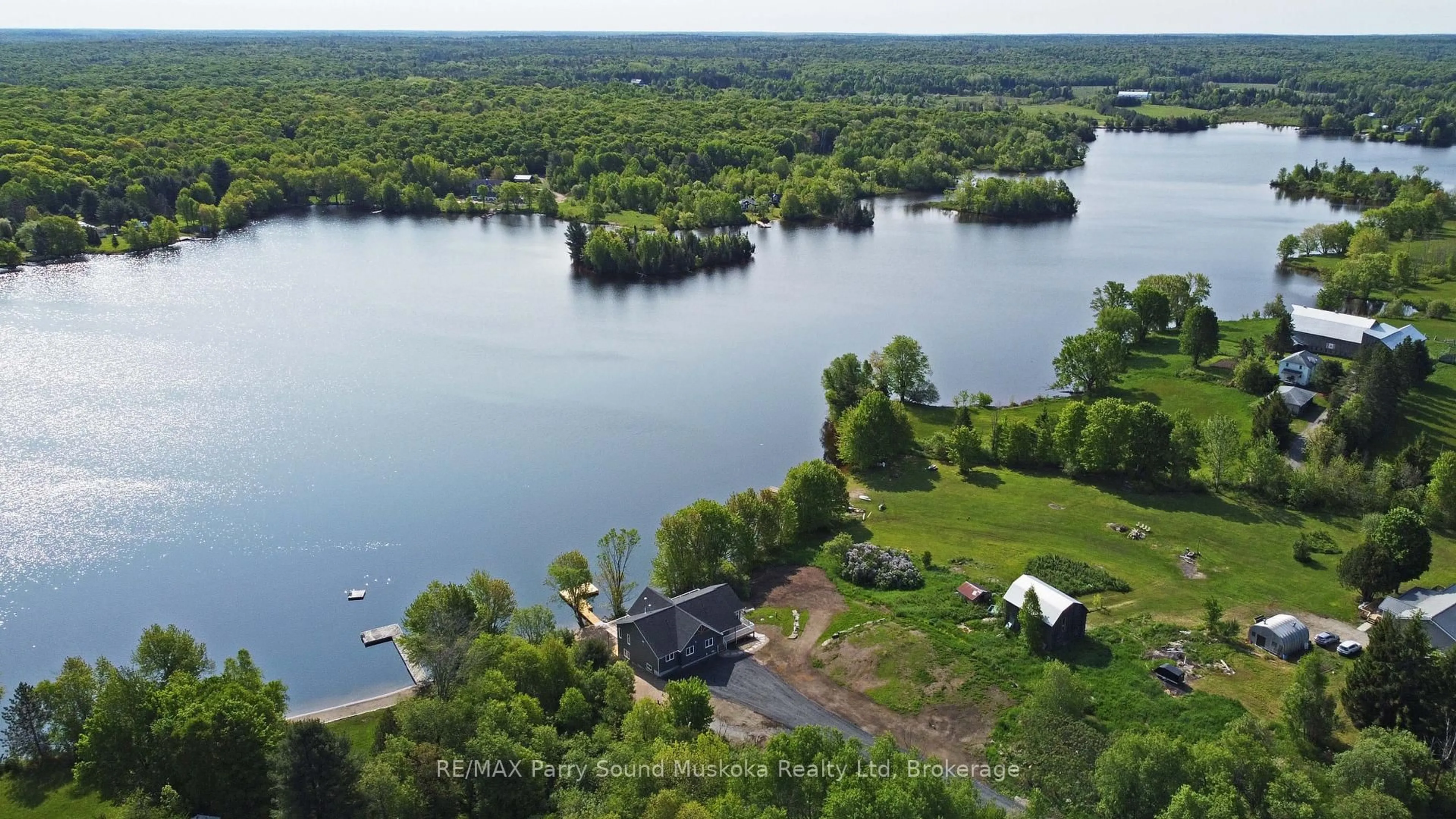 A pic from outside/outdoor area/front of a property/back of a property/a pic from drone, water/lake/river/ocean view for 49 Hardies Rd, McKellar Ontario P2A 0B5