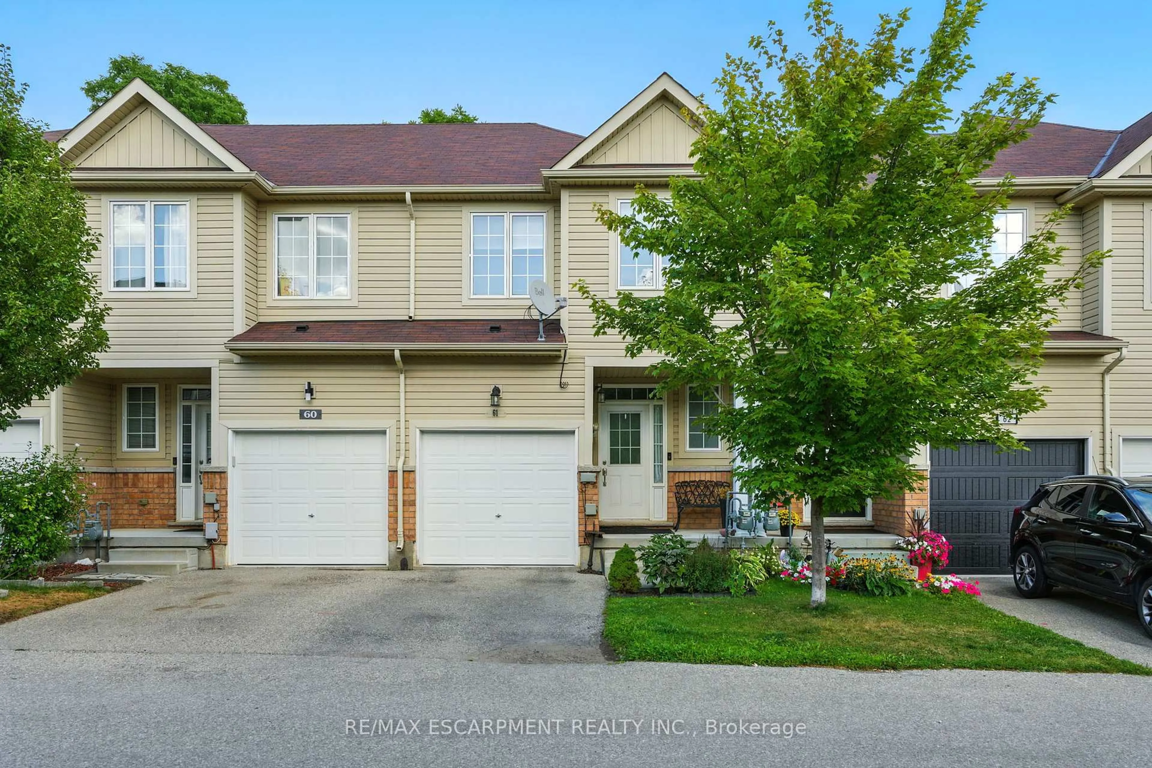 A pic from outside/outdoor area/front of a property/back of a property/a pic from drone, street for 21 Diana Ave #61, Brantford Ontario N3T 0G7