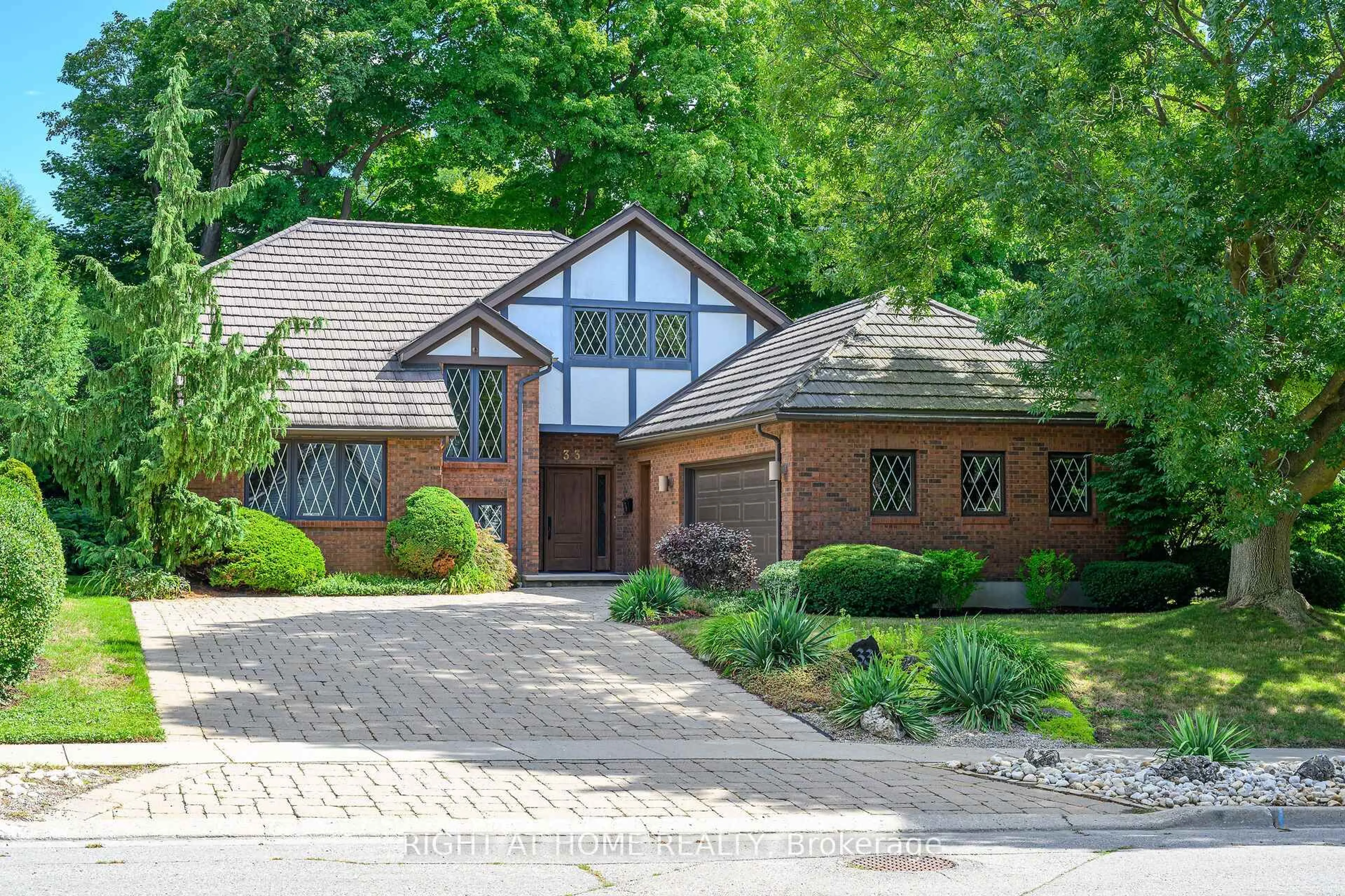 Home with brick exterior material, street for 33 Walnut Dr, Guelph Ontario N1E 4B4