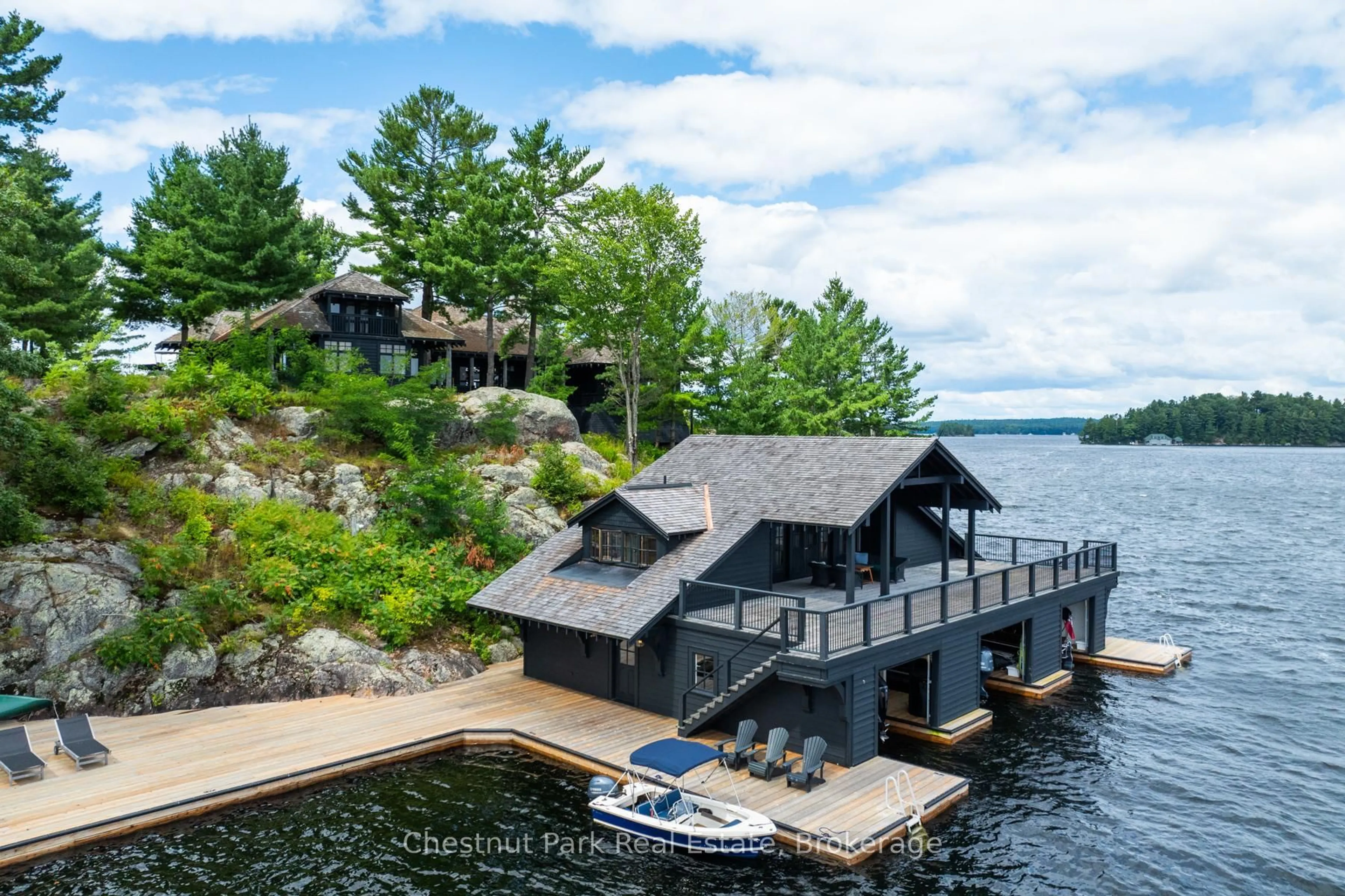 A pic from outside/outdoor area/front of a property/back of a property/a pic from drone, water/lake/river/ocean view for 1 Onaway Island, Muskoka Lakes Ontario P0B 1J0