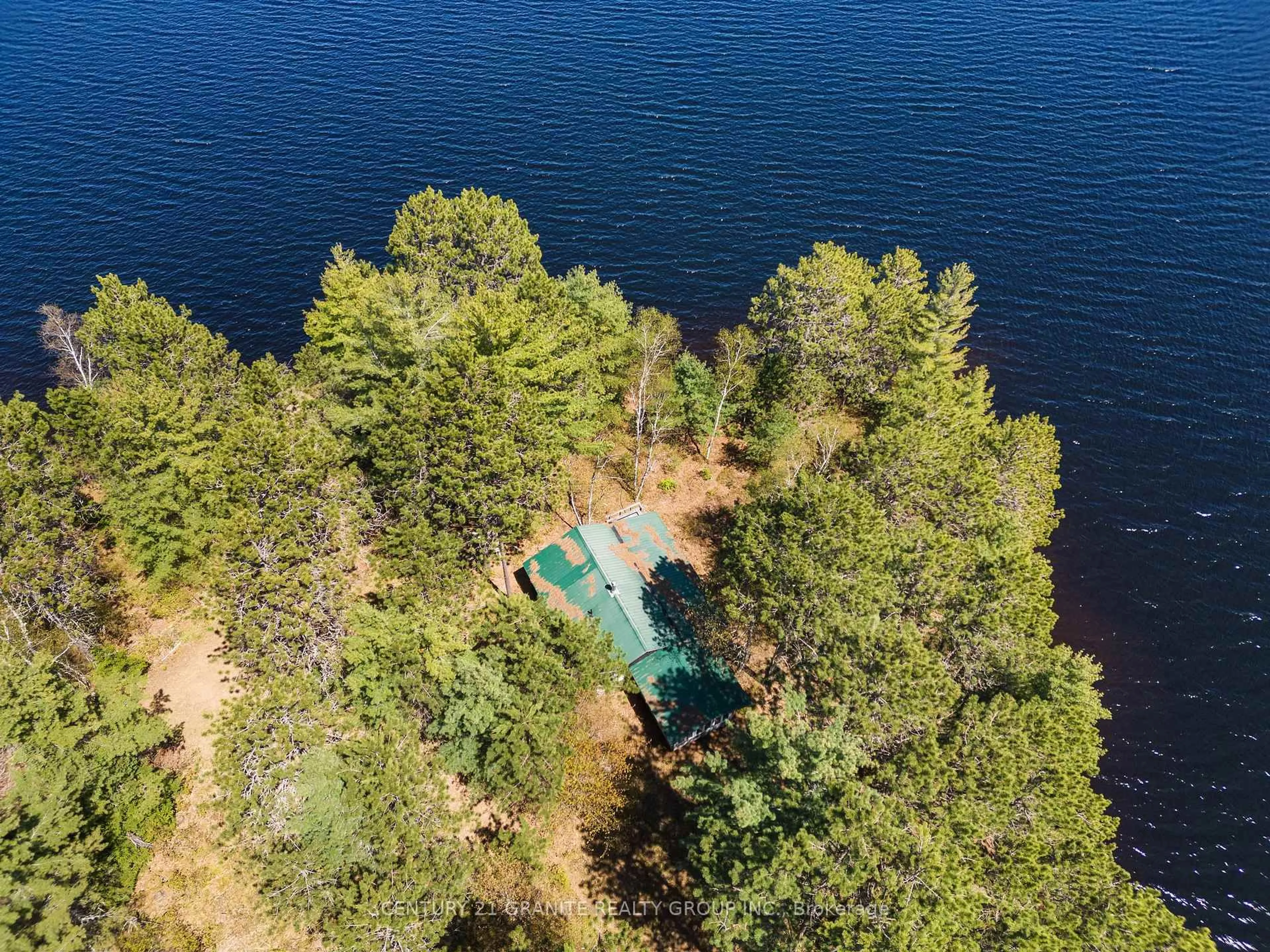 A pic from outside/outdoor area/front of a property/back of a property/a pic from drone, water/lake/river/ocean view for 39 Windmill Point Lane, South Algonquin Ontario K0J 2M0