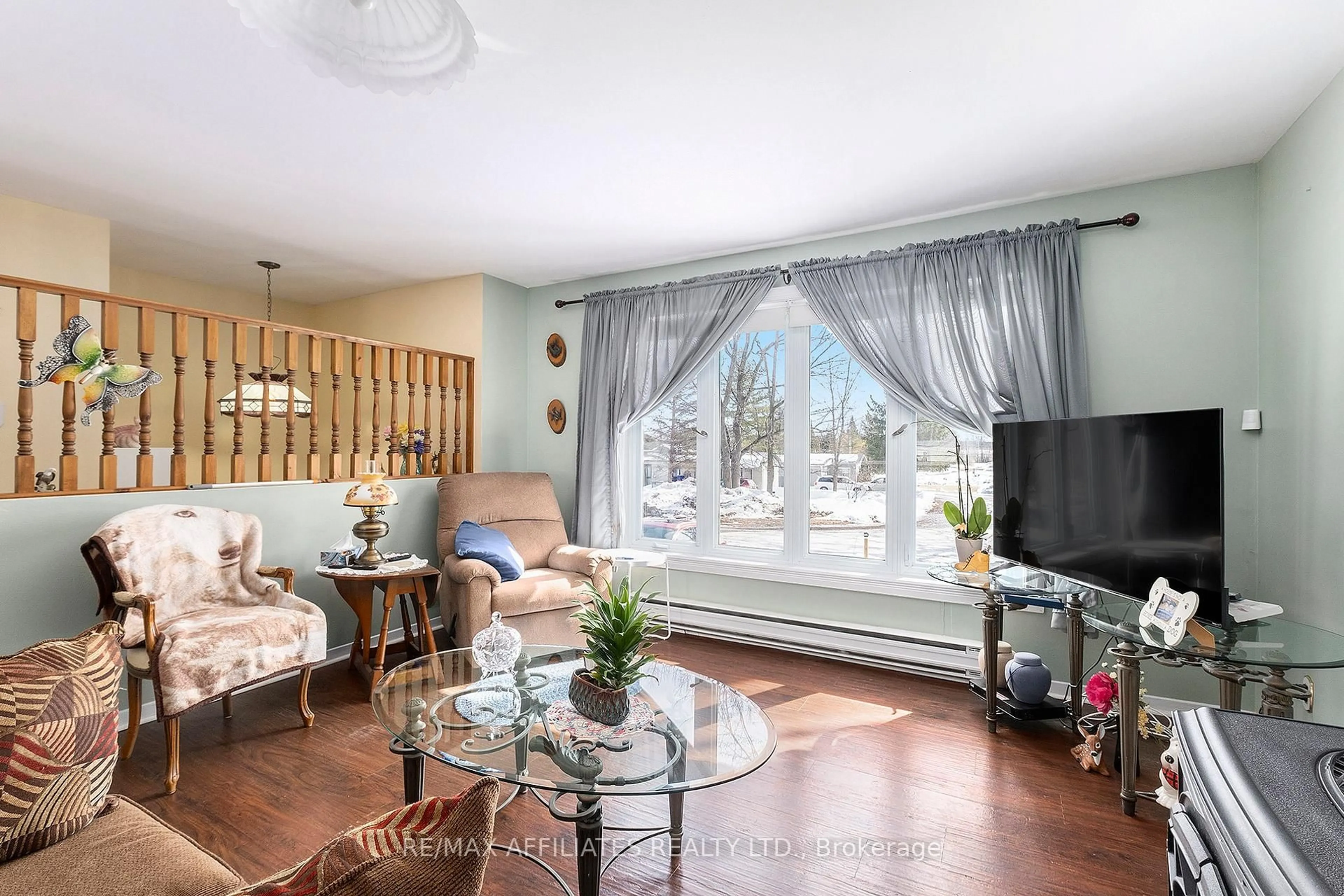 Living room with furniture, wood/laminate floor for 26 Salmon Side Rd #107, Rideau Lakes Ontario K7A 4S5