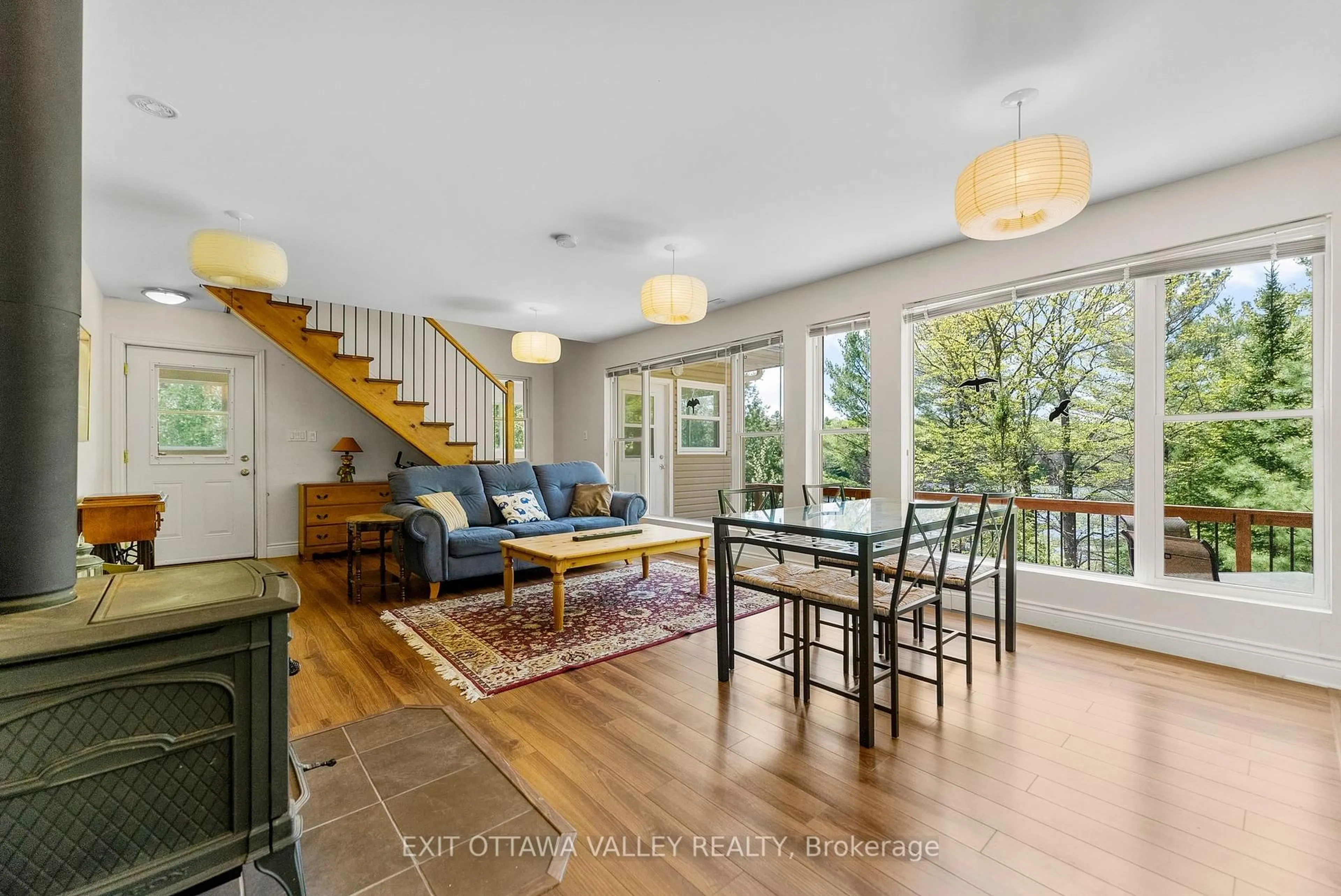 Living room with furniture, wood/laminate floor for 28084 Highway 41, Dacre Ontario K0J 1N0
