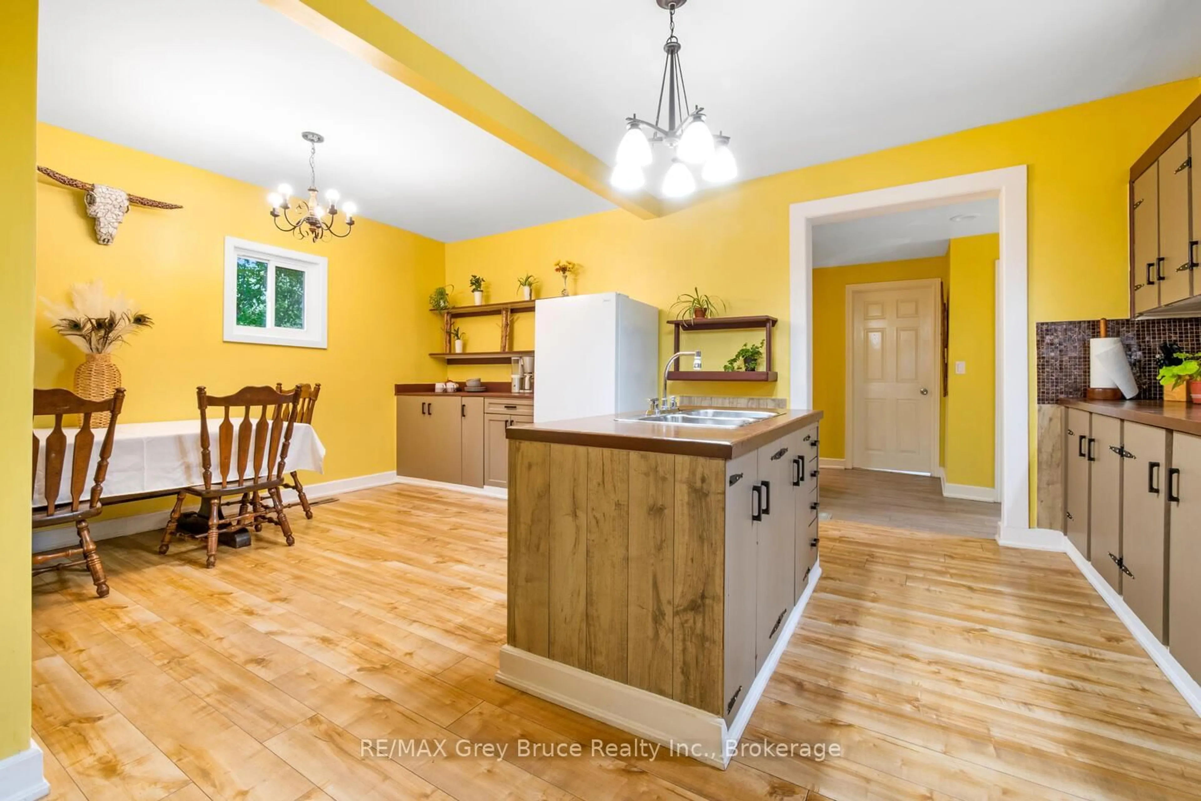 Open concept kitchen, wood/laminate floor for 243 Queen St, South Bruce Peninsula Ontario N0H 1P0