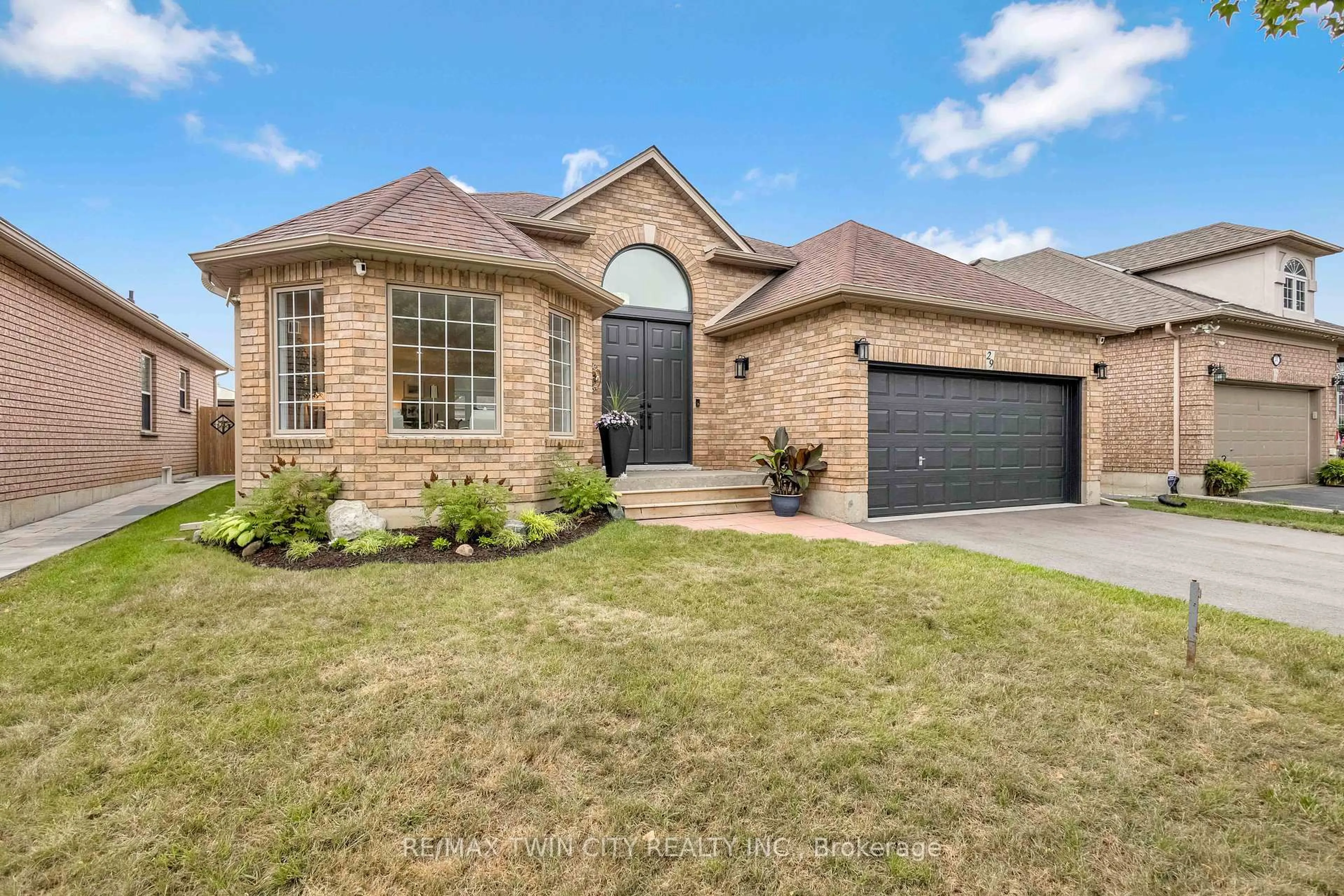 Home with brick exterior material, street for 29 Casson Lane, Brantford Ontario N3R 7Z5