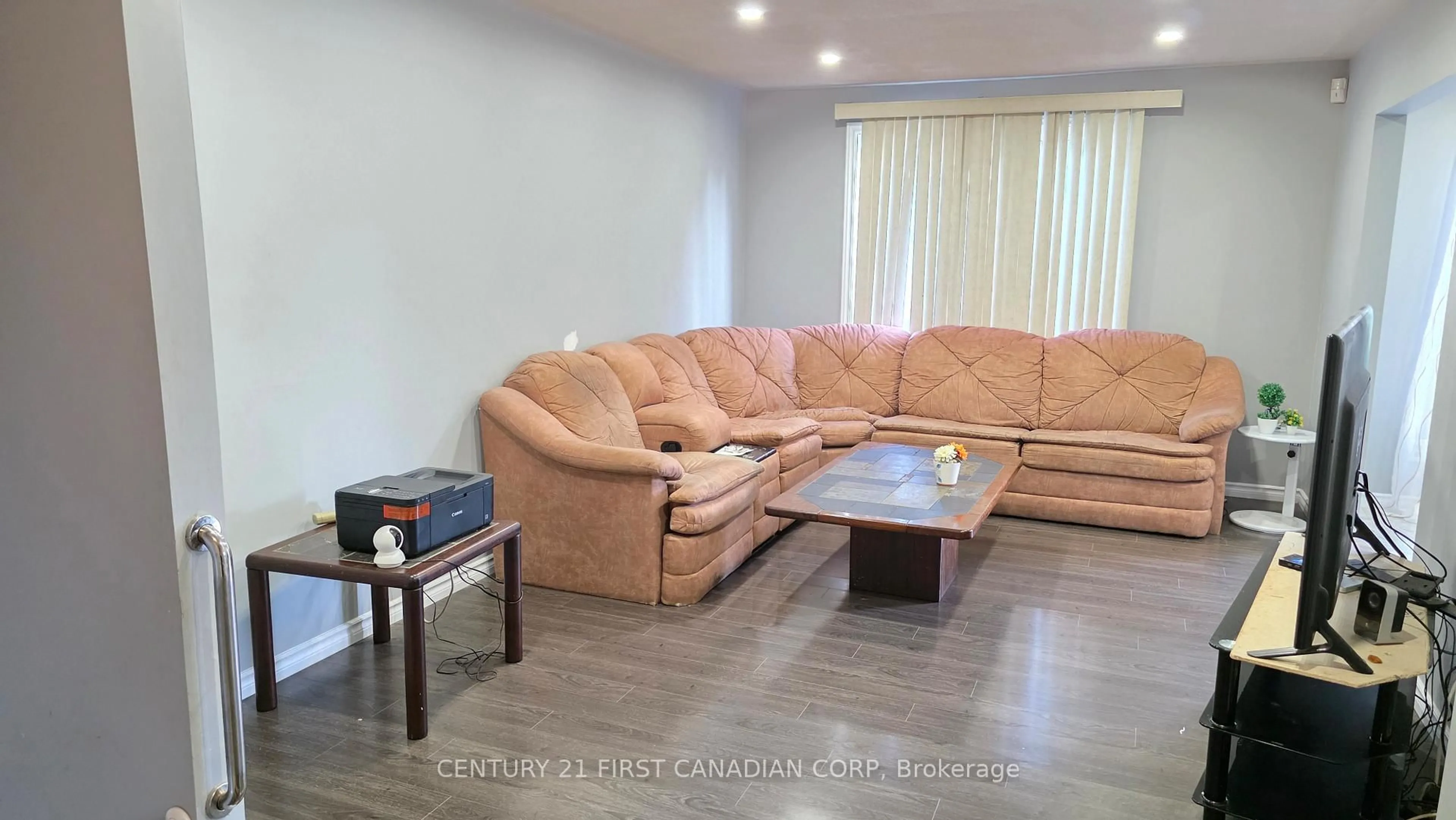 Living room with furniture, wood/laminate floor for 2 Muriel Cres, London South Ontario N6E 2K5