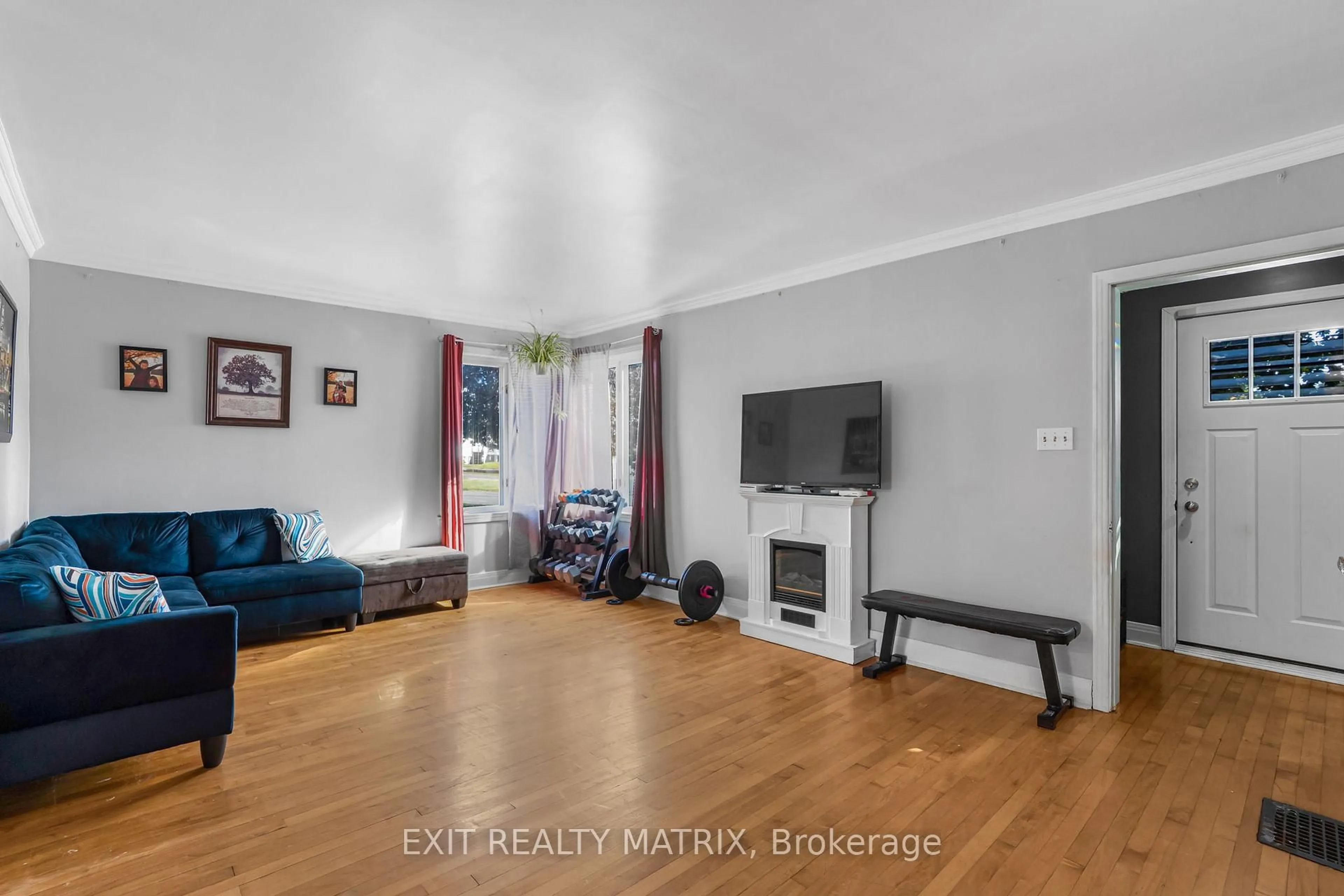 Living room with furniture, wood/laminate floor for 453 Garneau Rd, Hawkesbury Ontario K6A 1M6