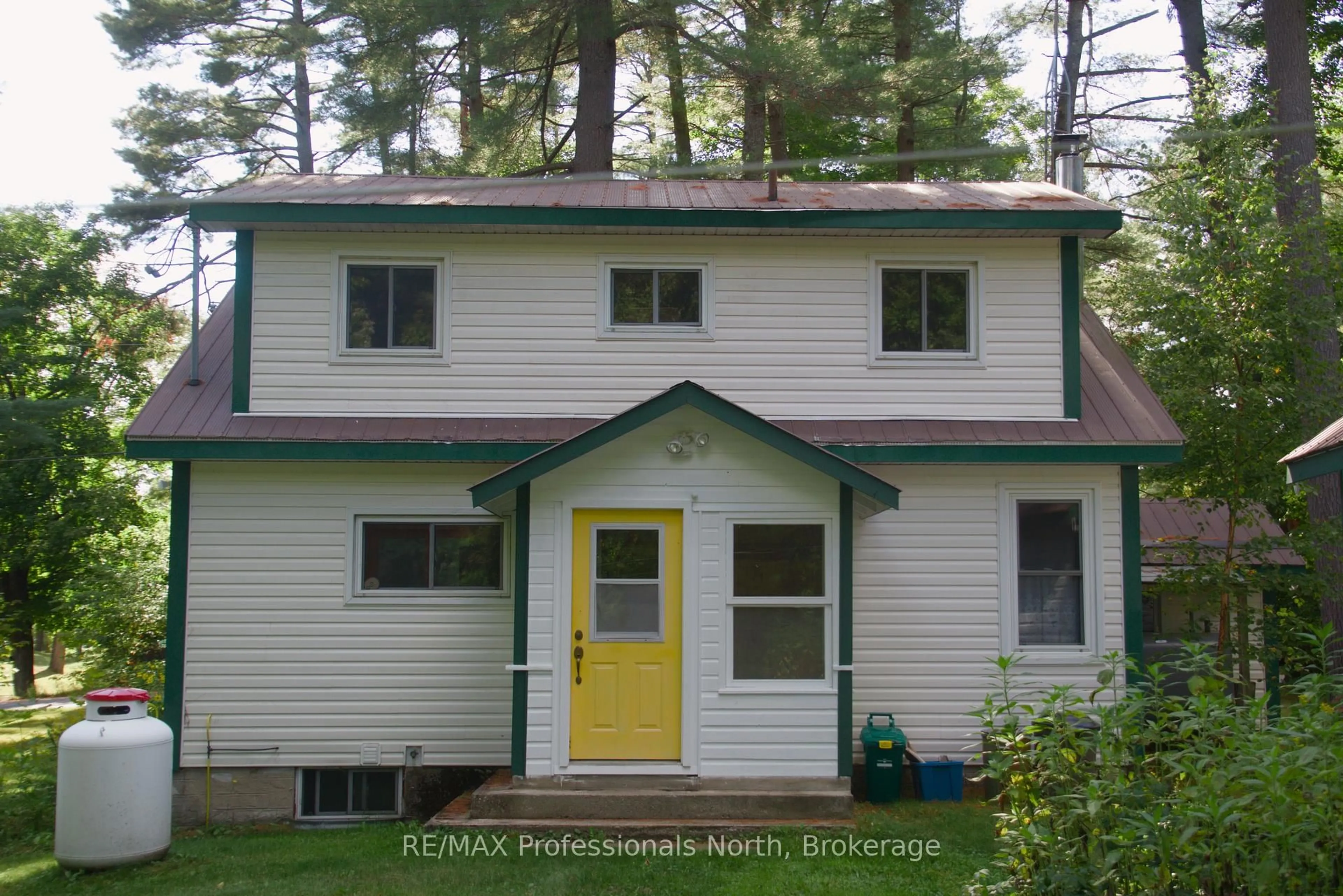 Home with vinyl exterior material, street for 49 Beach Rd, Huntsville Ontario P0B 1M0