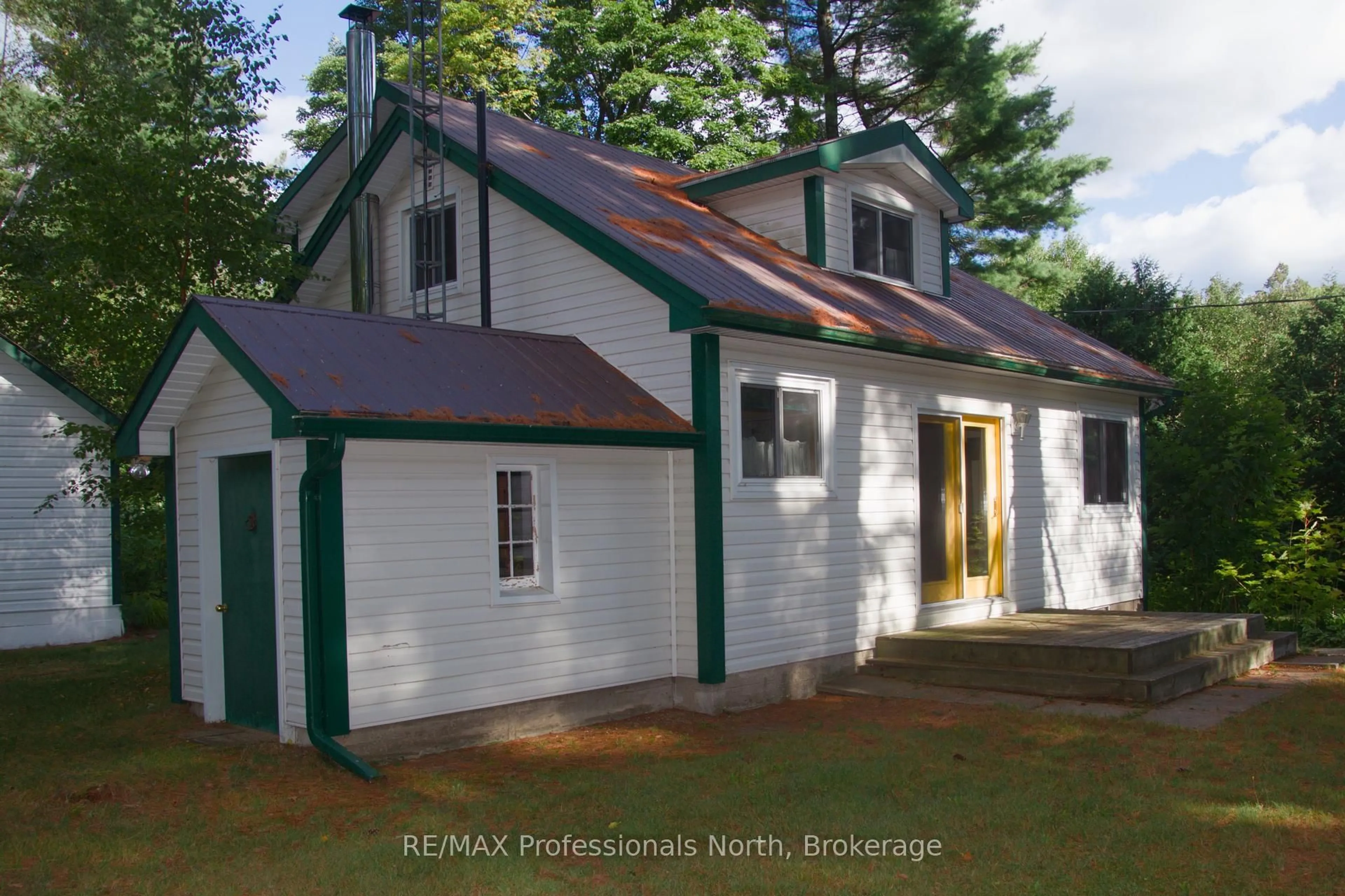 Home with vinyl exterior material, street for 49 Beach Rd, Huntsville Ontario P0B 1M0
