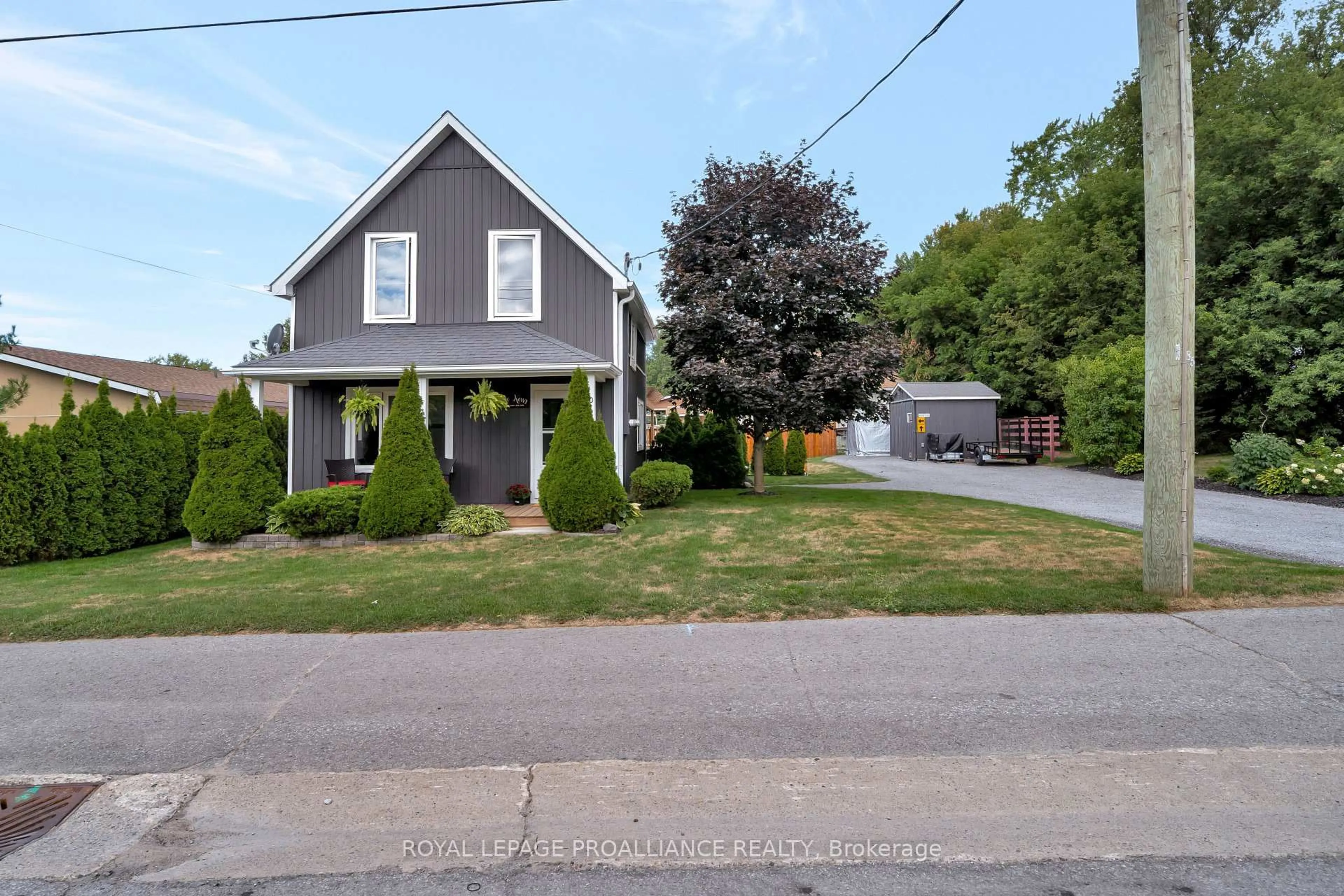 A pic from outside/outdoor area/front of a property/back of a property/a pic from drone, street for 30 Lake St, Prince Edward County Ontario K0K 2T0