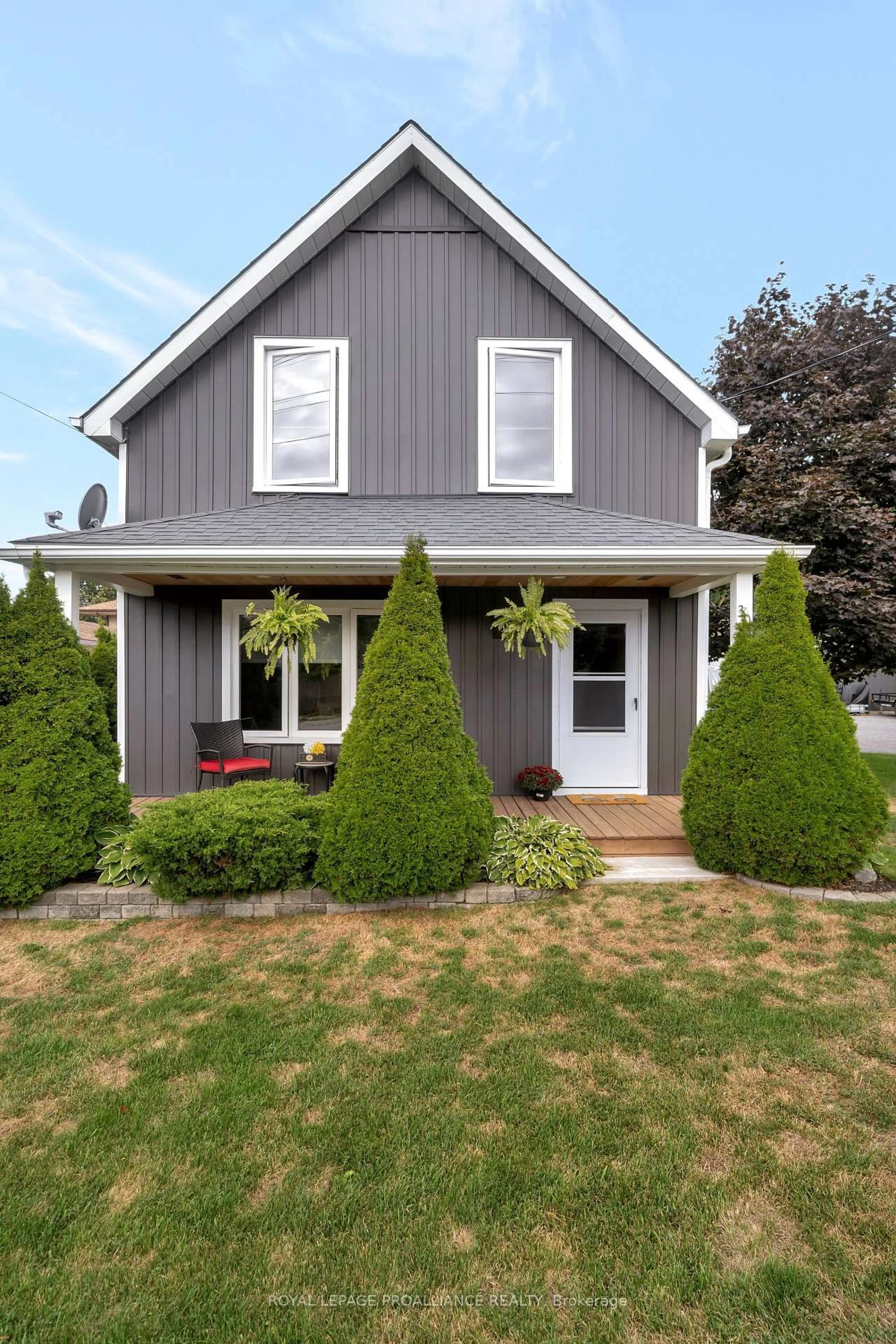 Home with vinyl exterior material, street for 30 Lake St, Prince Edward County Ontario K0K 2T0